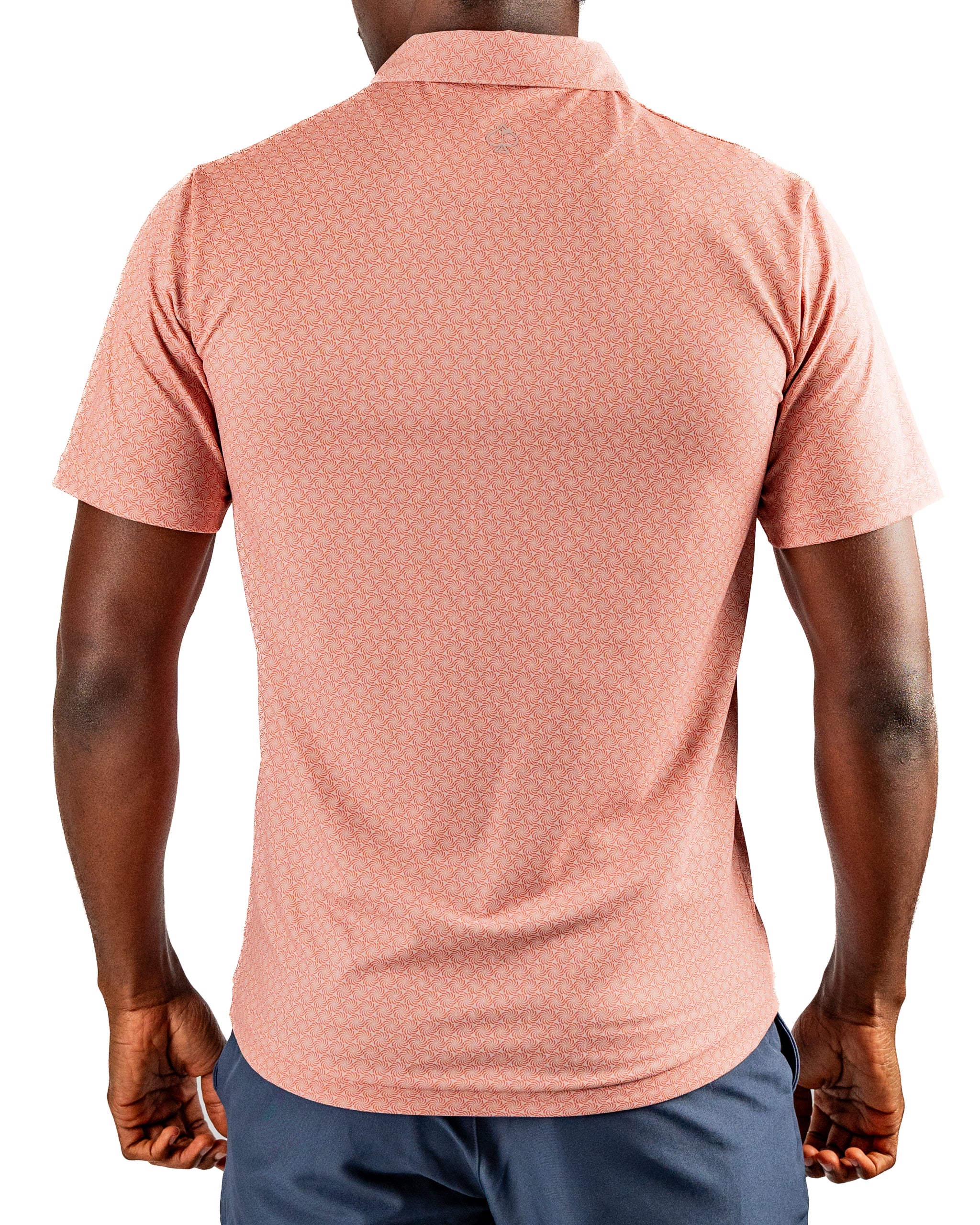 Men's Phoenix Whirl golf shirt in a soft pink hue, featuring a subtle geometric pattern and a comfortable fit.