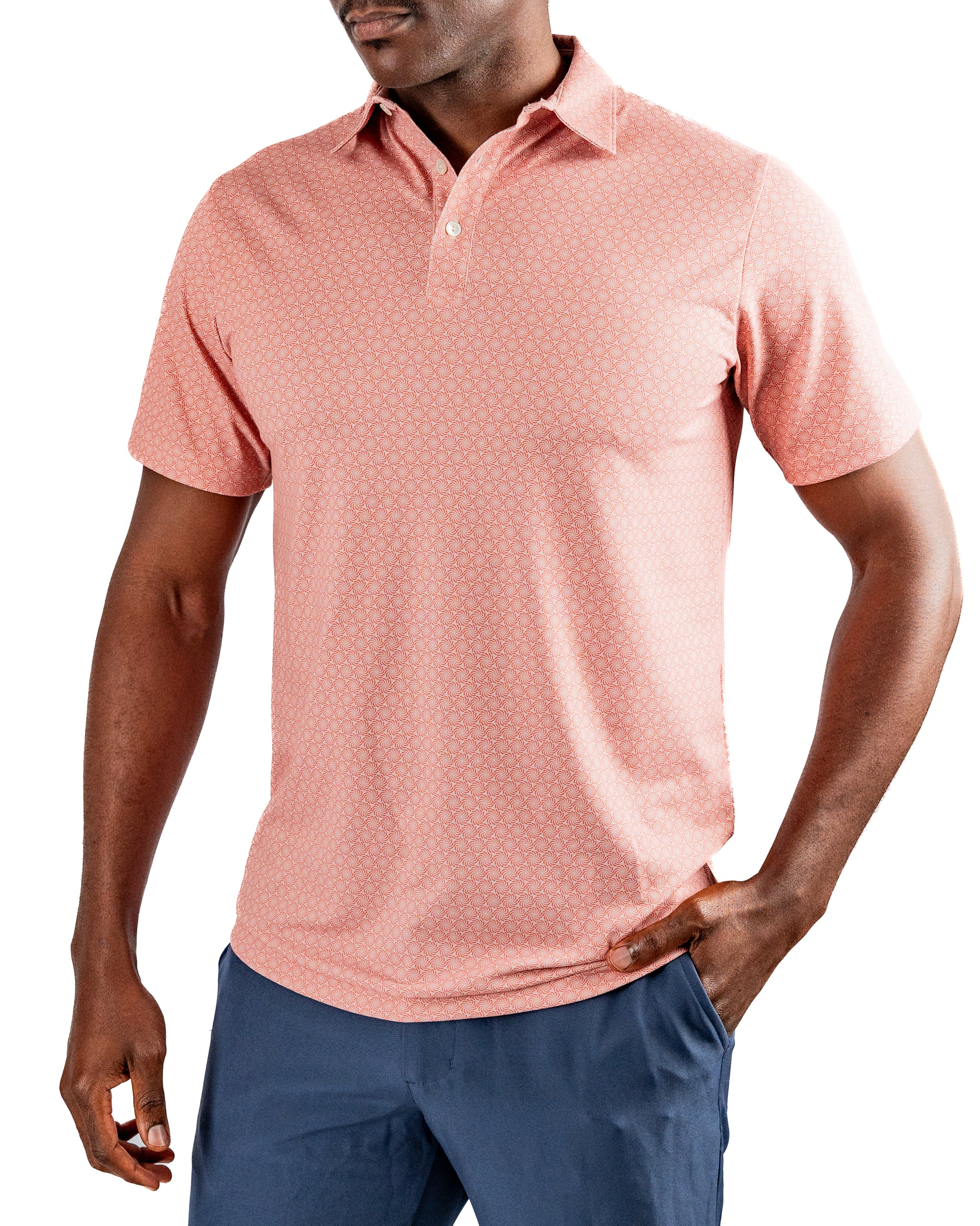 Men's Phoenix Whirl golf polo in coral with a subtle geometric pattern, designed for comfort and style on the course.