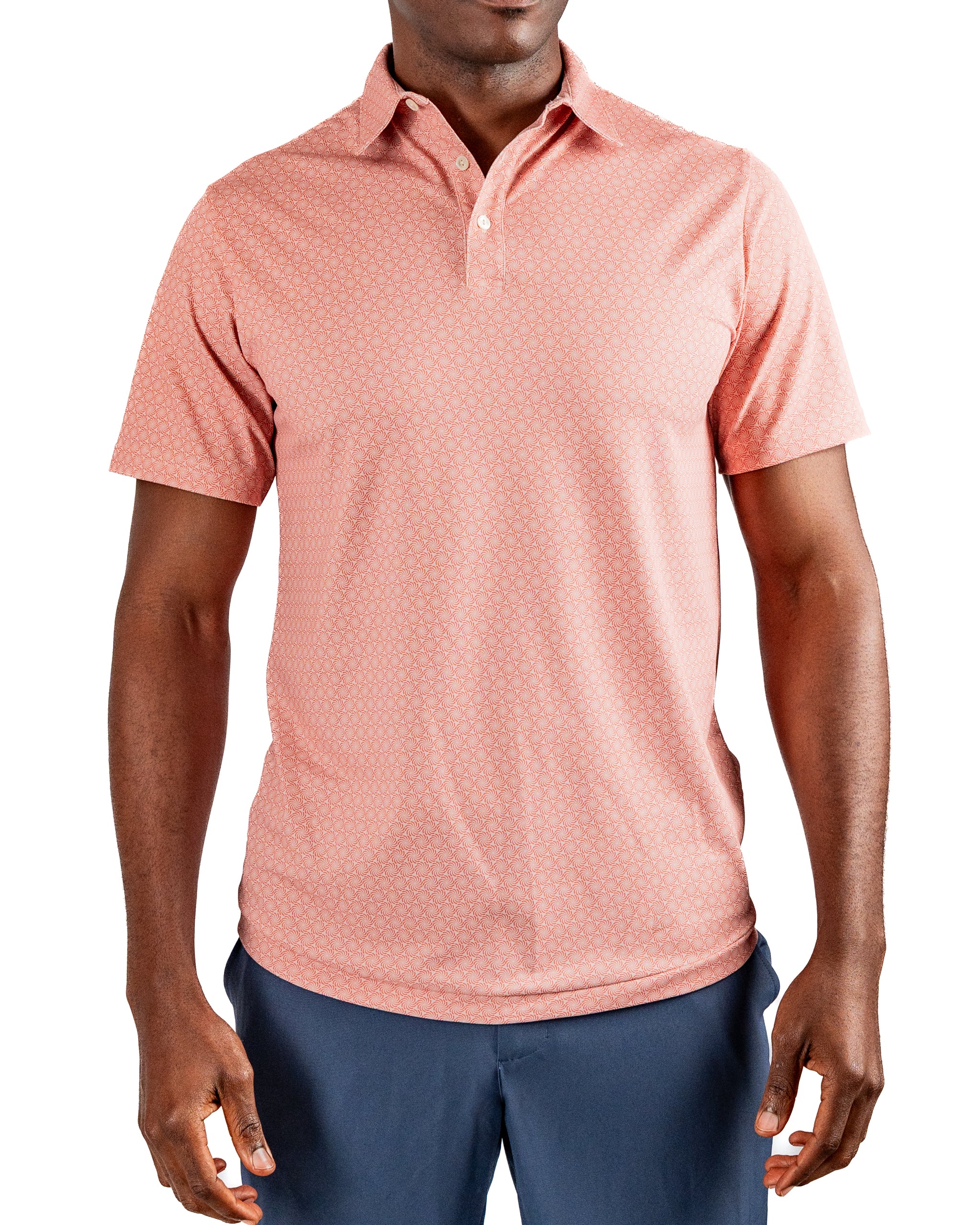 Men's Phoenix Whirl golf polo in coral with a subtle geometric pattern, designed for comfort and style on the course.