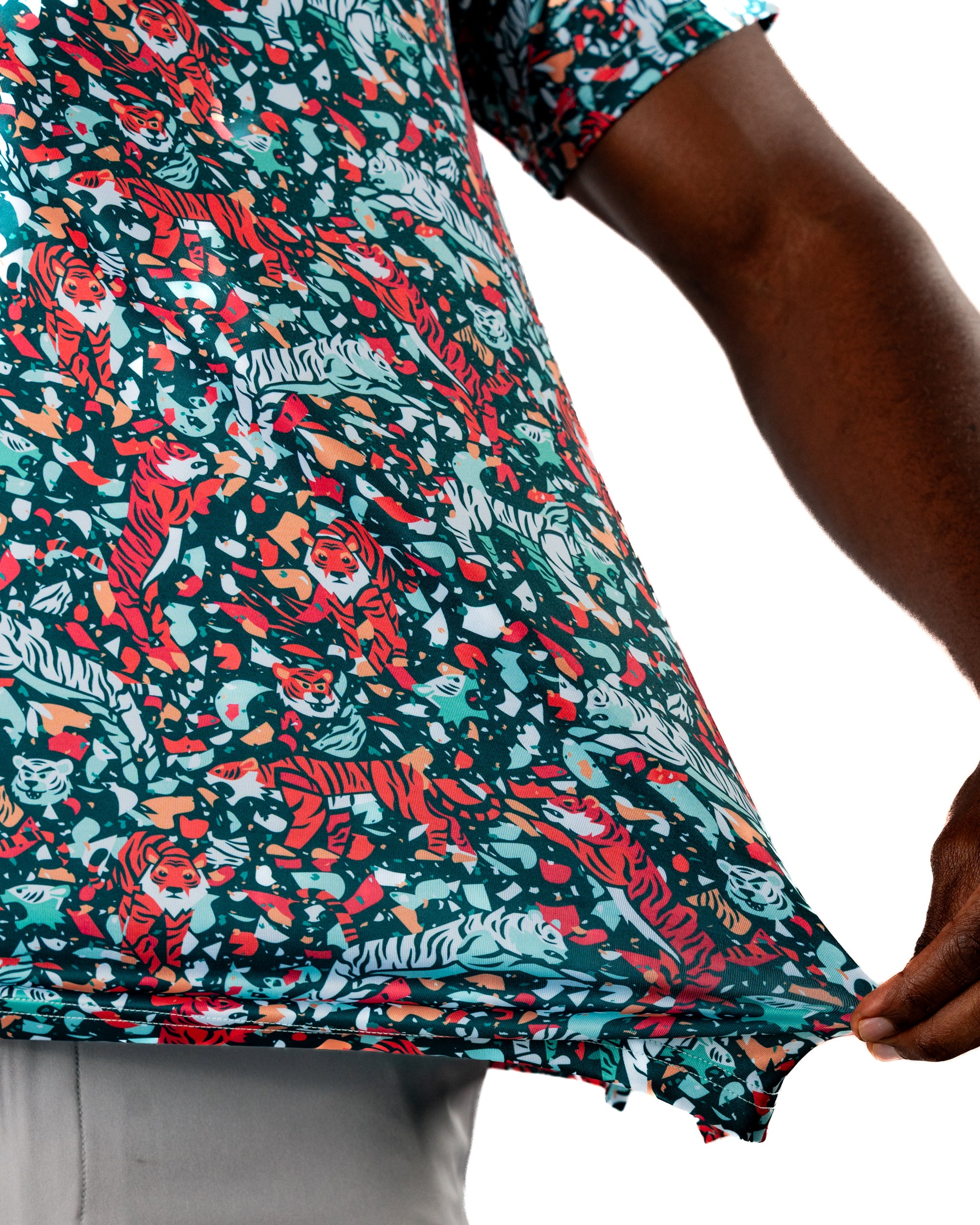 Bold golf shirt featuring a vibrant teal pattern with playful tiger graphics, perfect for making a statement on the course.
