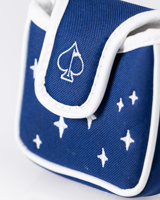 Navy mallet putter cover featuring a spade logo and star designs, inspired by NASA space themes for bold golfers.