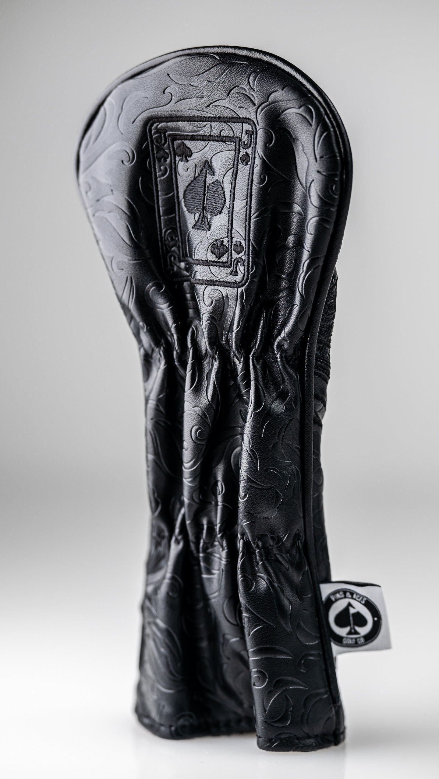 Blackout Jack of Spades hybrid cover featuring a sleek black design with embossed detailing and a card motif.