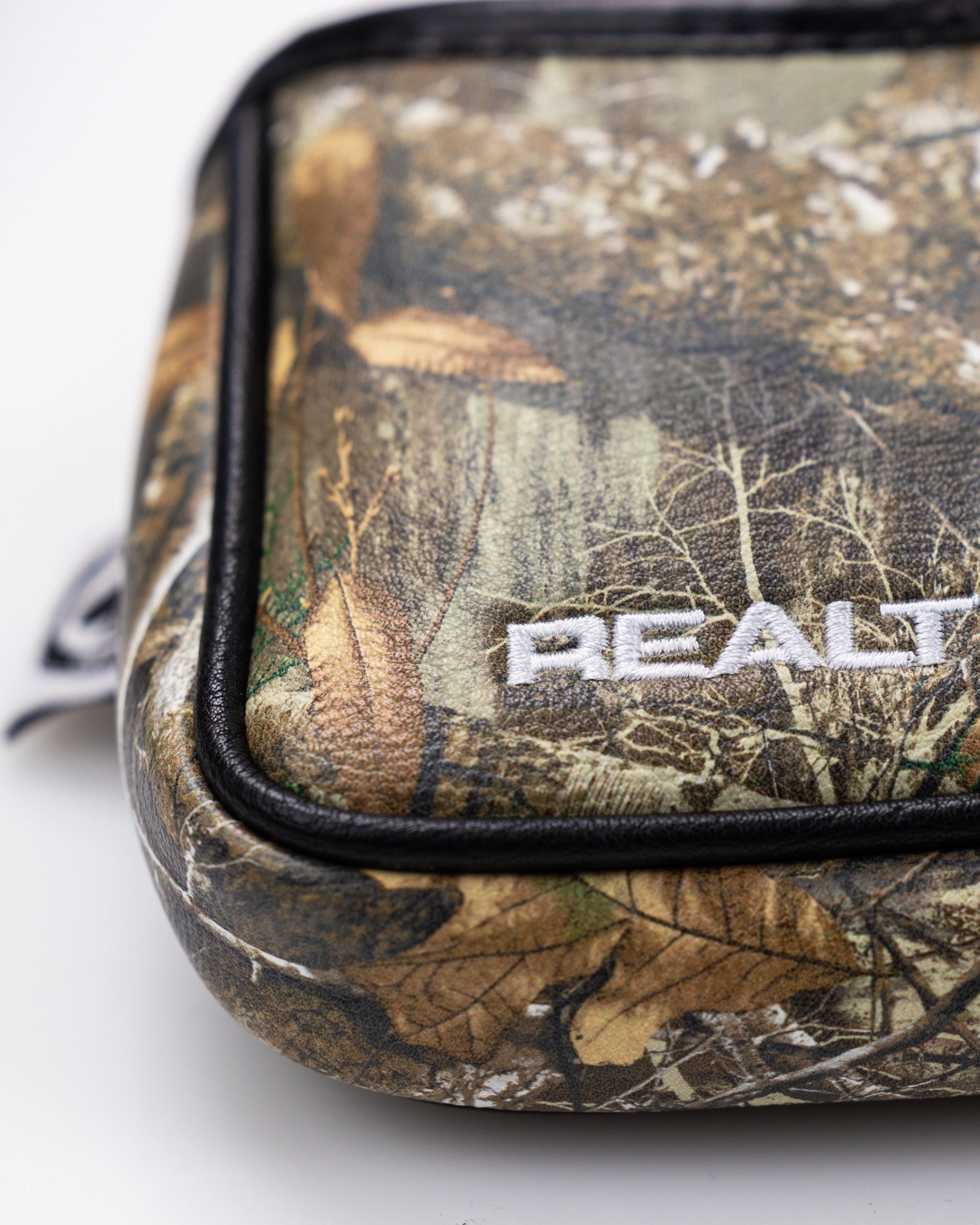 Realtree mallet cover featuring a camouflage design with leaves and branches, ideal for golfers seeking unique accessories.