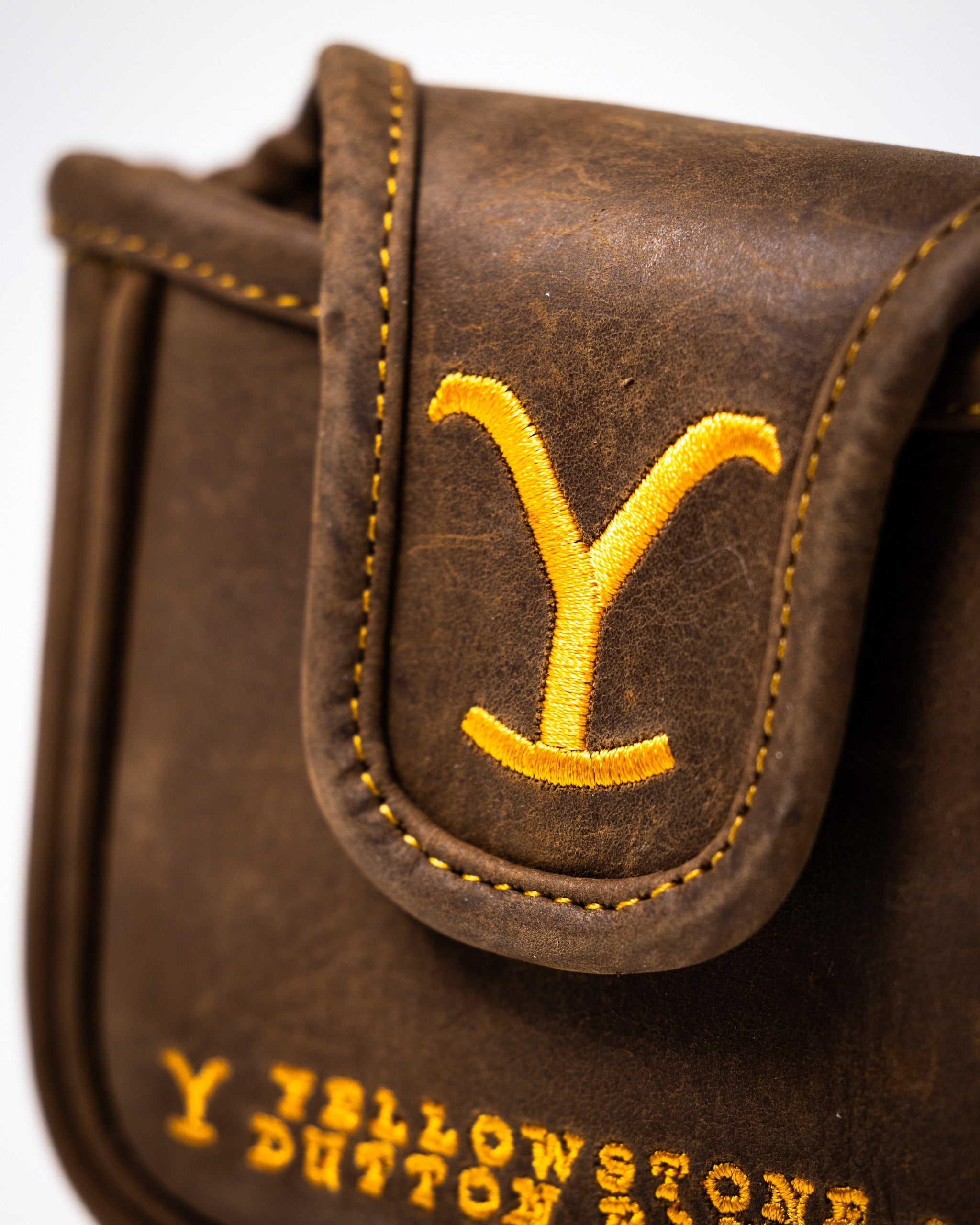 Yellowstone mallet putter cover featuring a stylish brown leather design and vibrant yellow embroidery.