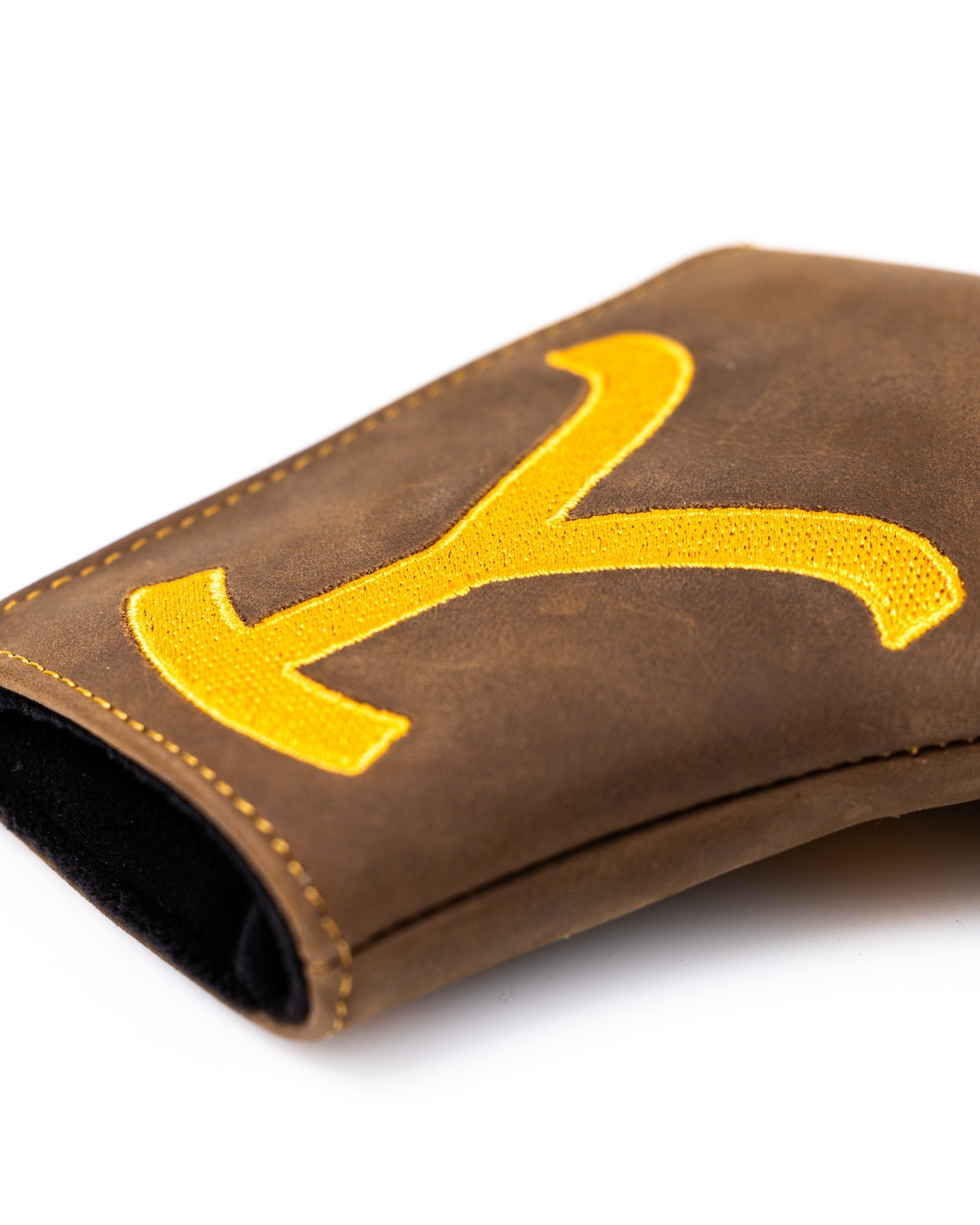 Yellowstone putter cover in brown leather featuring a bold yellow 'Y' design, perfect for stylish golfers.