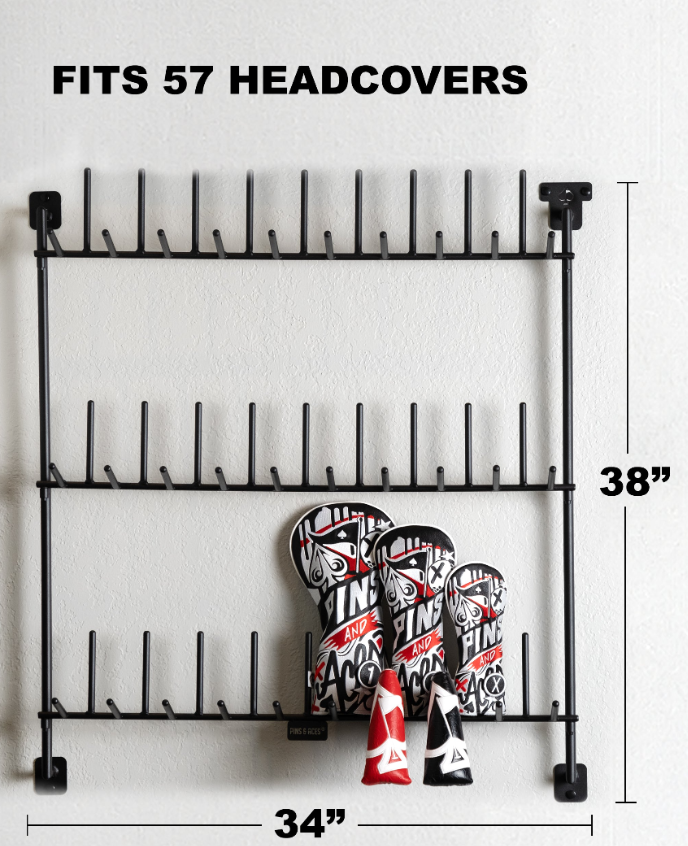 Headcover rack displaying three bold golf headcovers, designed to hold up to 57 headcovers, mounted on a wall.
