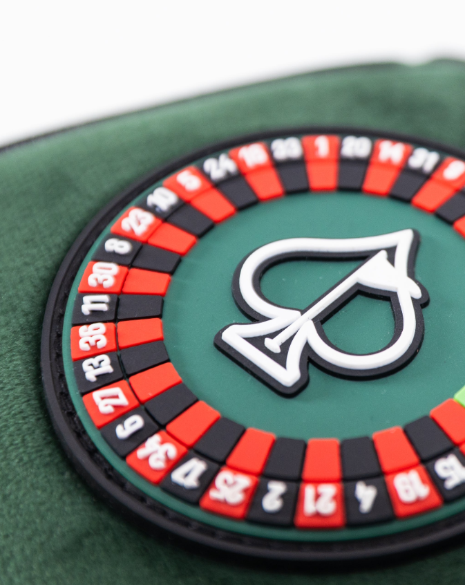 Bold green mallet putter cover featuring a roulette wheel design with red and black accents for stylish golf play.