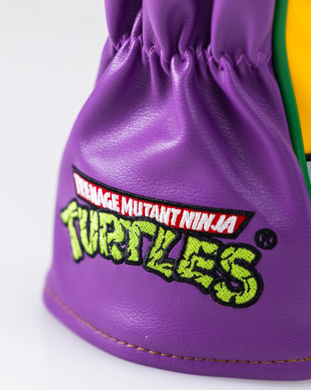 Purple fairway cover featuring Donatello from Teenage Mutant Ninja Turtles with embroidered logo and vibrant colors.