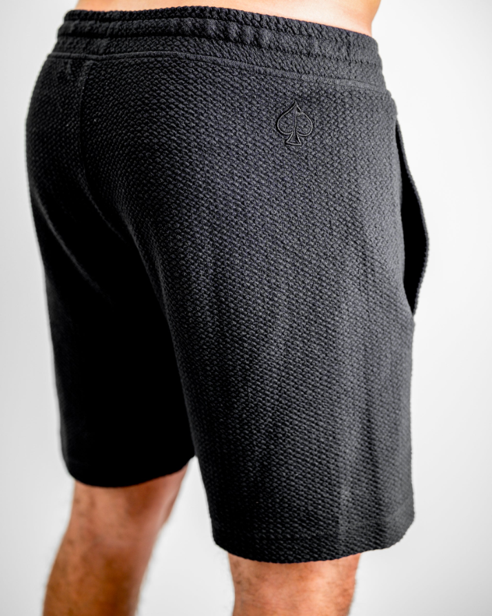 Men's Player Preferred waffle knit shorts in obsidian, featuring a textured fabric and logo detail on the back.