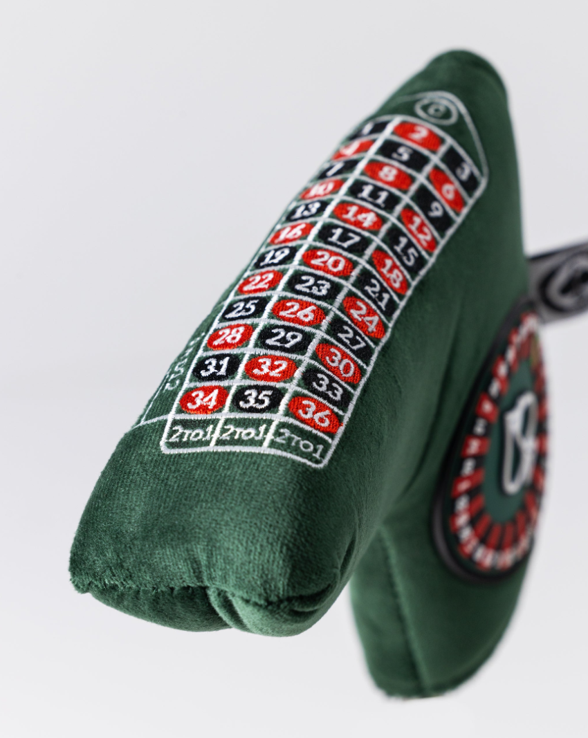 Bold green blade putter cover featuring a roulette wheel design and numbered betting layout for stylish golf protection.