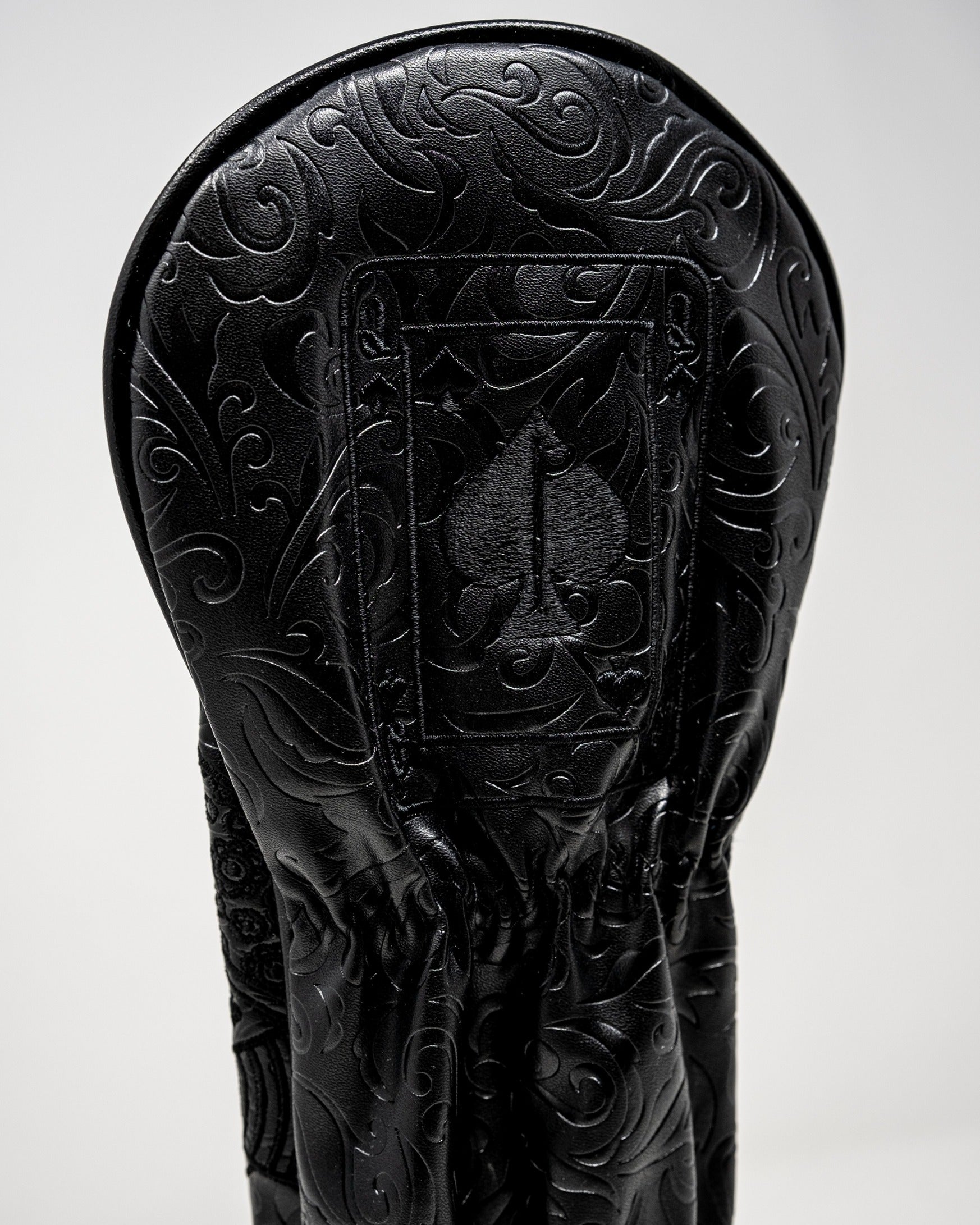 Blackout Queen of Spades fairway cover featuring an intricate embossed design in sleek black leather.
