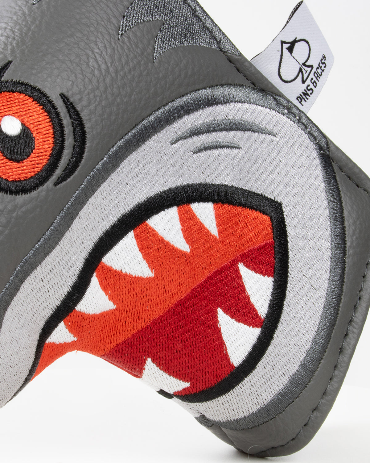 Bold Hammerhead shark design putter cover in gray with vibrant orange and red details, perfect for standout golf style.
