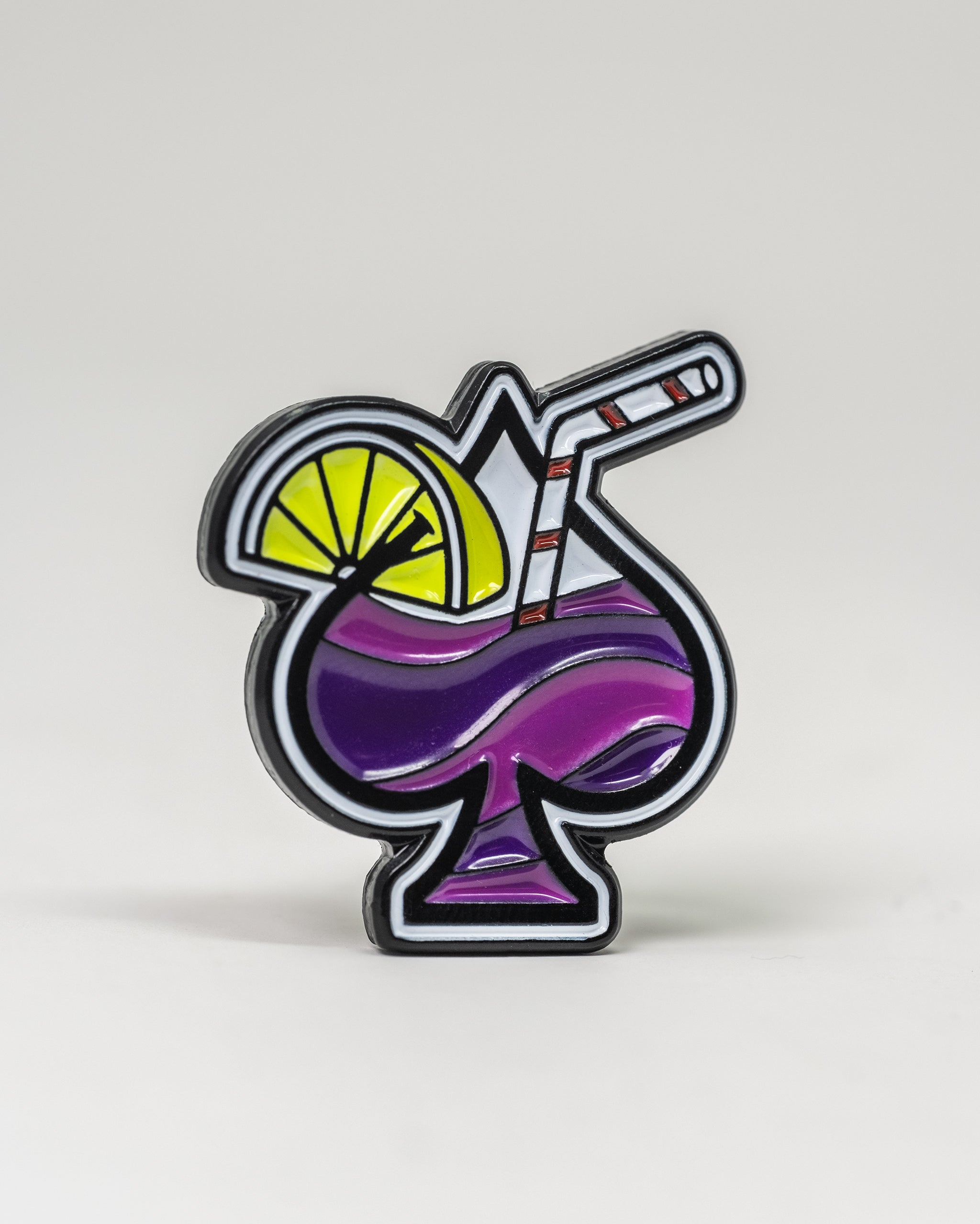 Colorful Transfusion Spade Ball Marker featuring a cocktail design with a lemon slice and straw, perfect for stylish golfers.