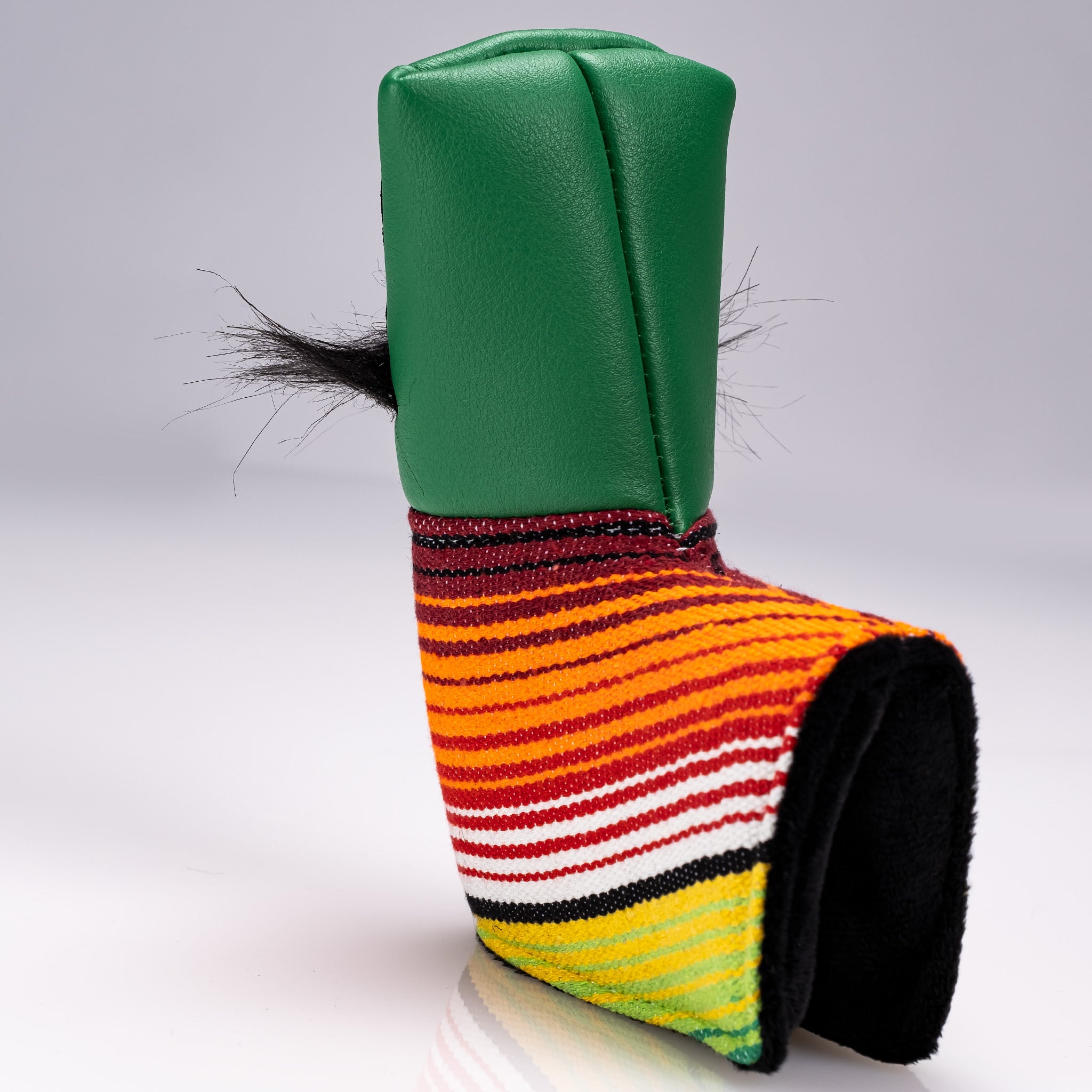 Bold green blade putter cover featuring a mustache sugar skull design with vibrant striped accents for standout style on the course.