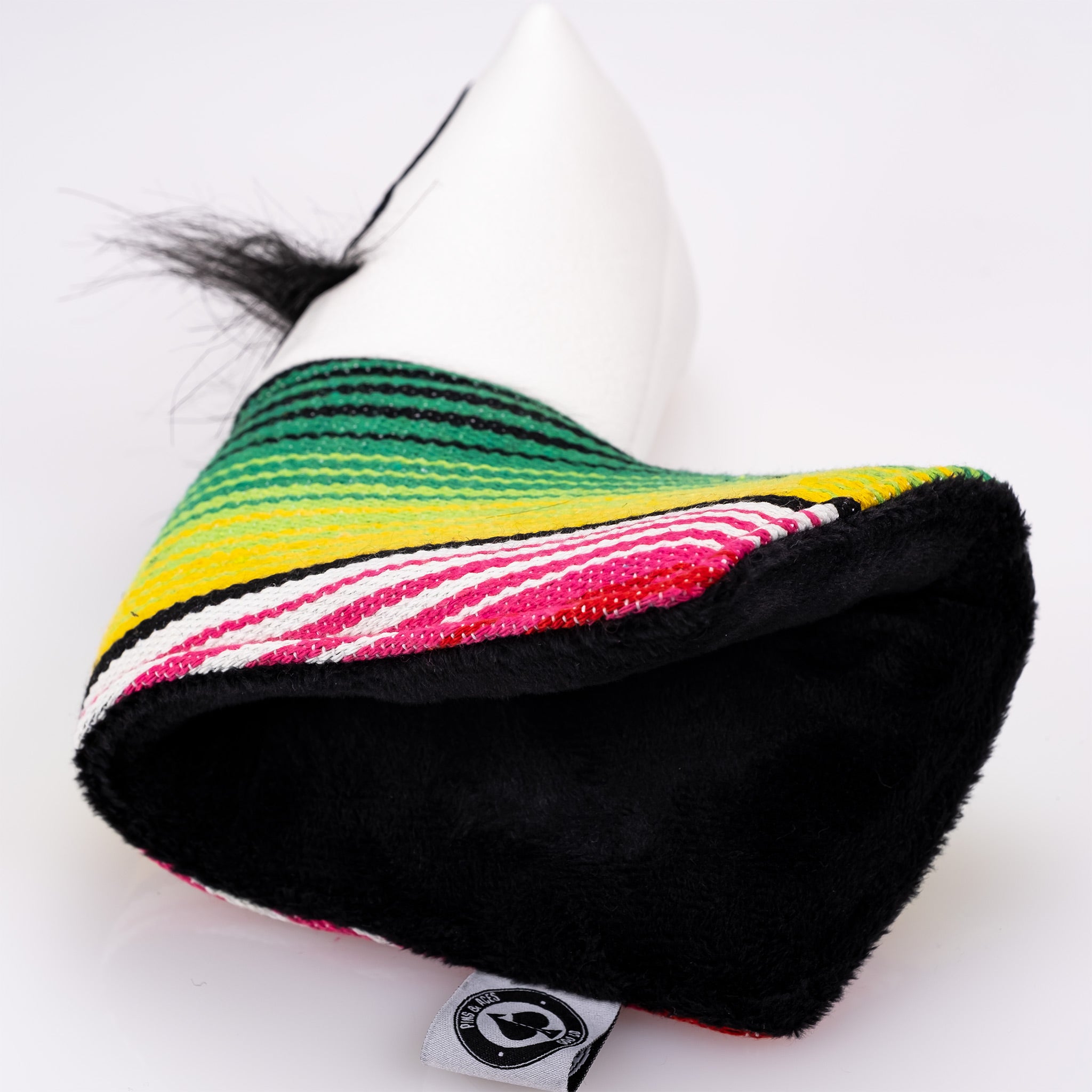 White blade putter cover featuring a mustache sugar skull design with vibrant striped detailing and a soft black interior.