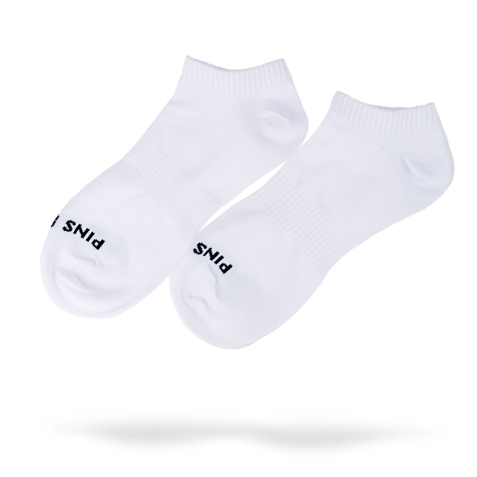 Ankle-length white socks featuring the Pins logo, designed for comfort and style on the golf course.