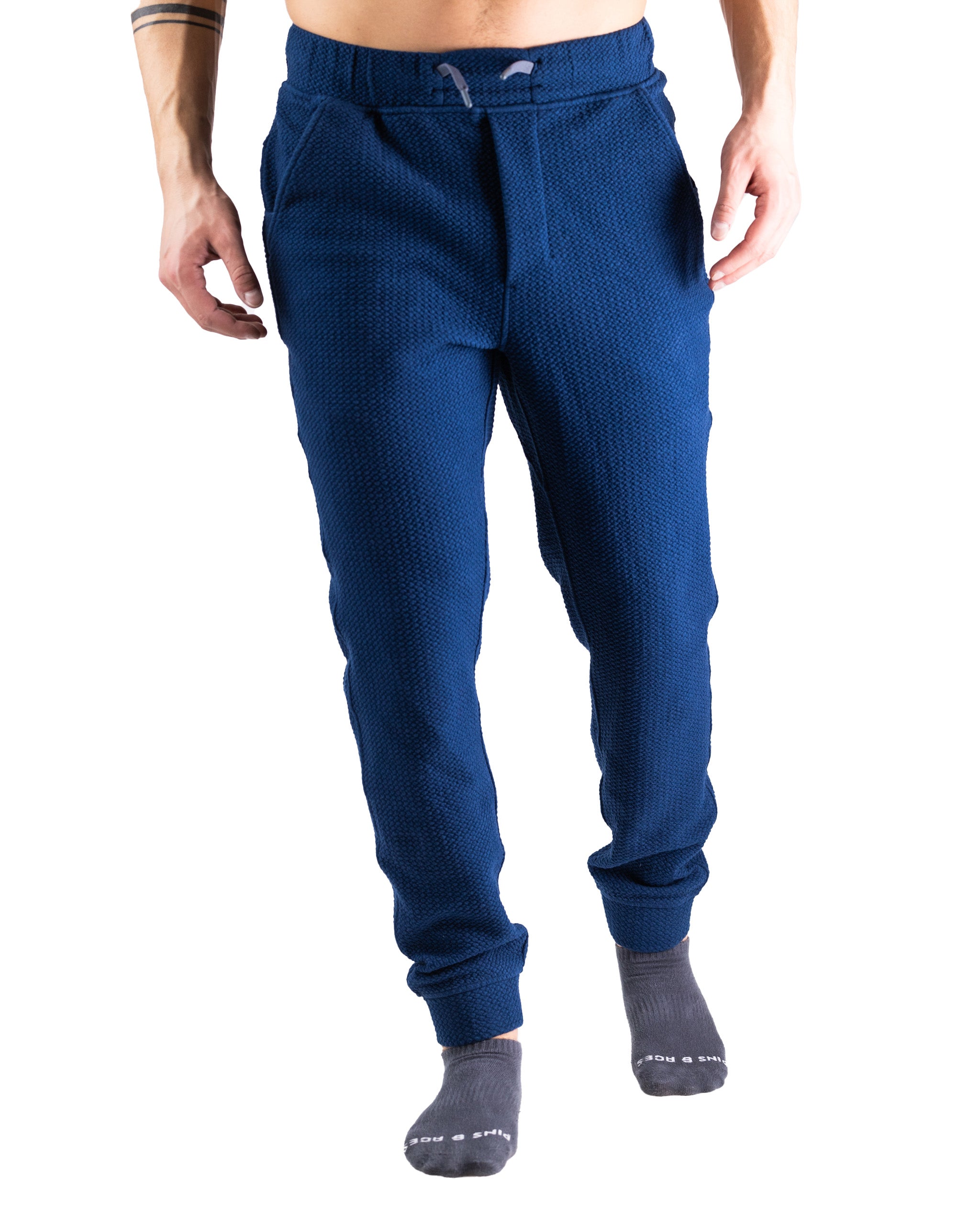 Men's navy waffle-knit jogger pants featuring a comfortable fit and elastic waistband, perfect for casual wear or lounging.