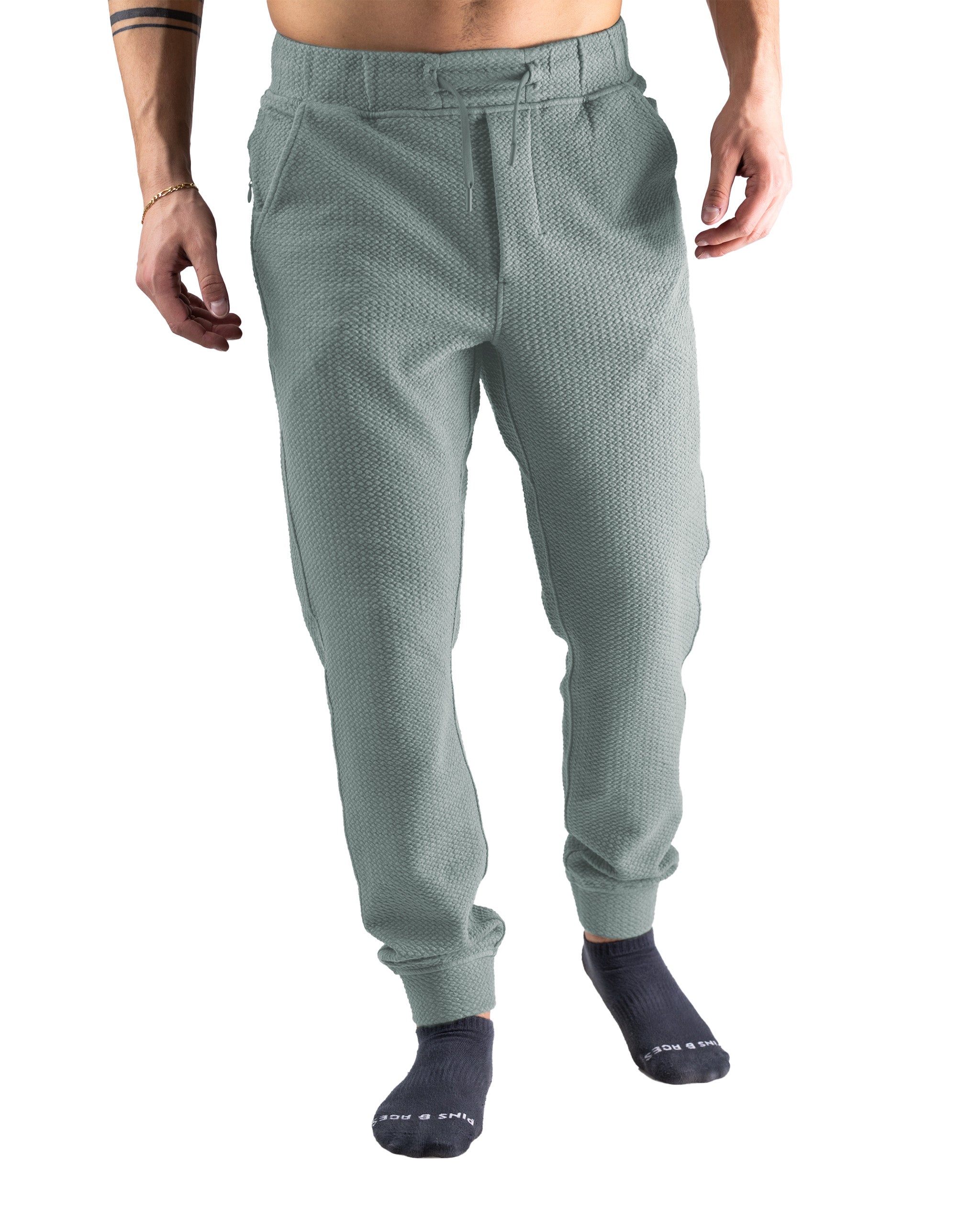 Men's sage green waffle knit joggers featuring a relaxed fit and elastic waistband, perfect for casual wear and comfort.