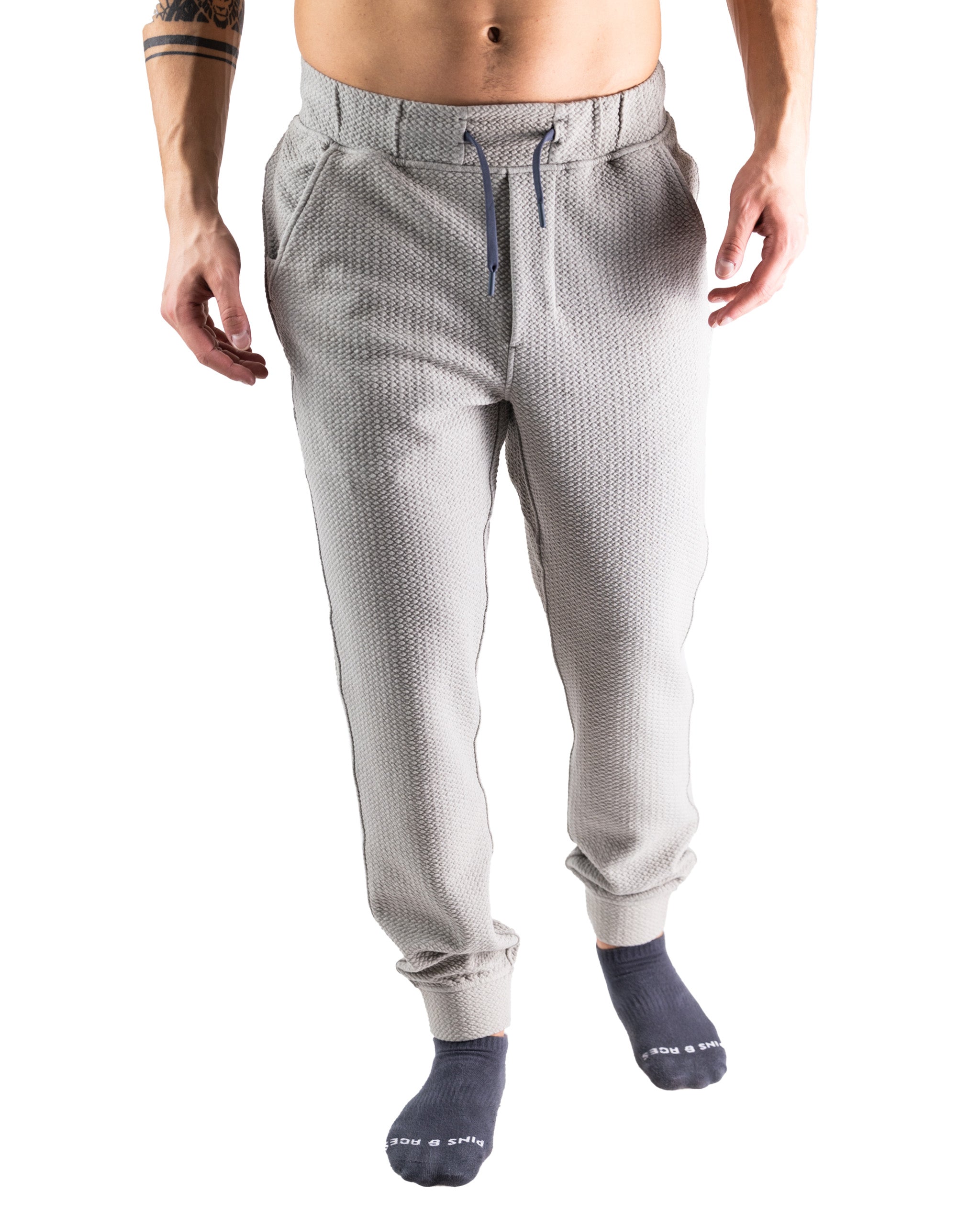 Men's slate waffle-knit jogger featuring a relaxed fit, elastic waistband, and cuffed ankles for comfort and style.