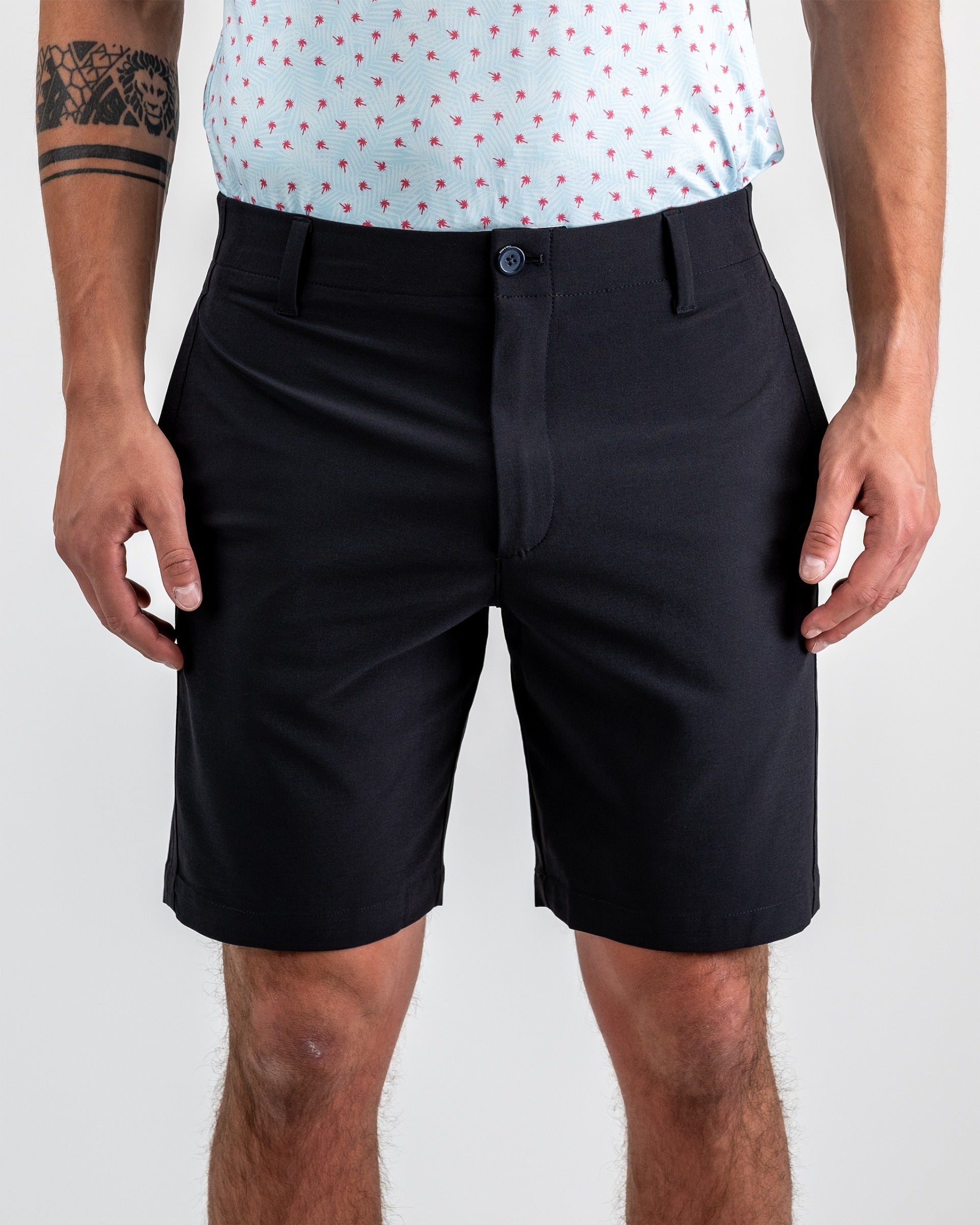 Men's black performance shorts featuring a classic fit and comfortable fabric, ideal for active wear on the golf course.