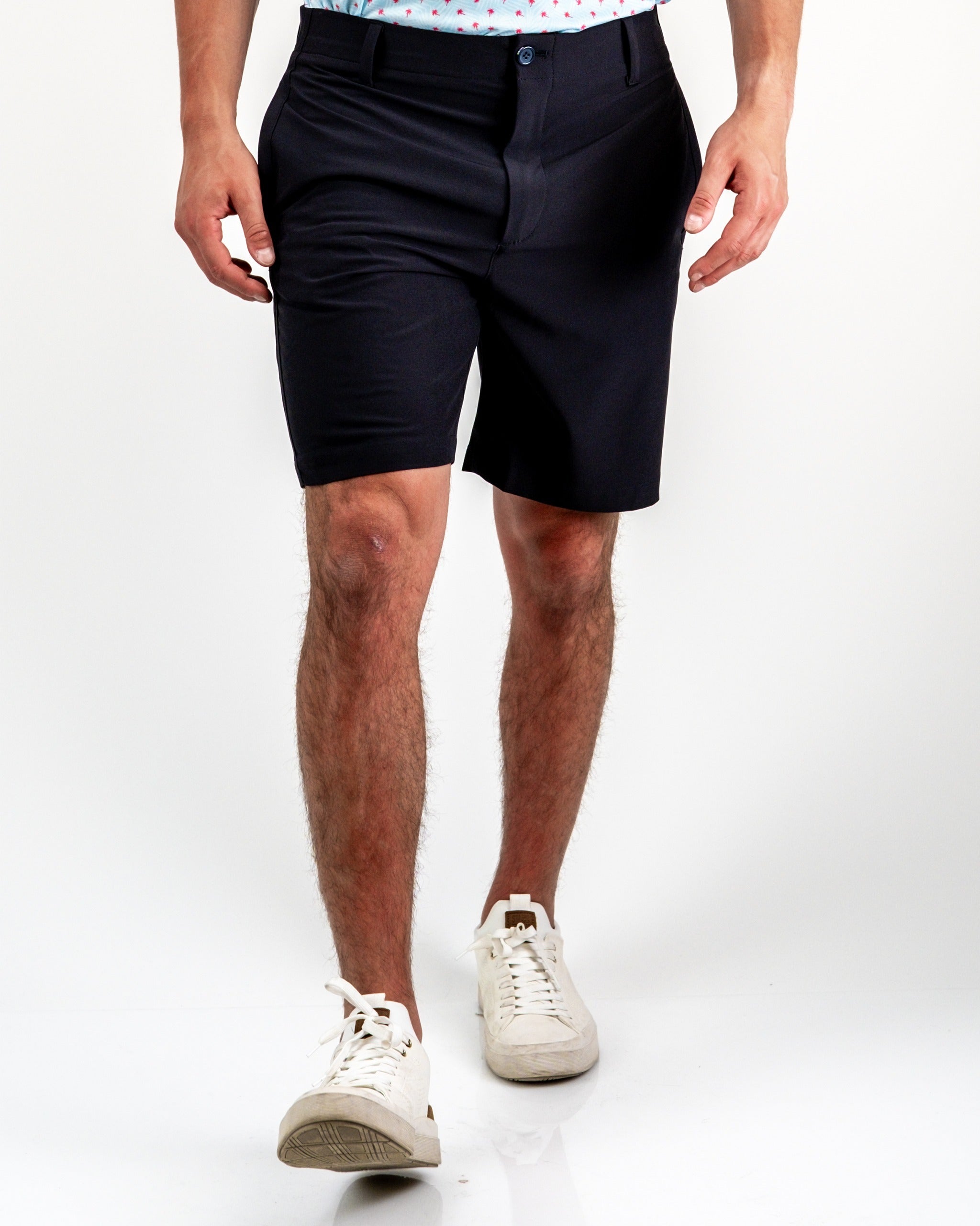 Men's black performance shorts designed for comfort and style on the golf course, featuring a tailored fit and breathable fabric.