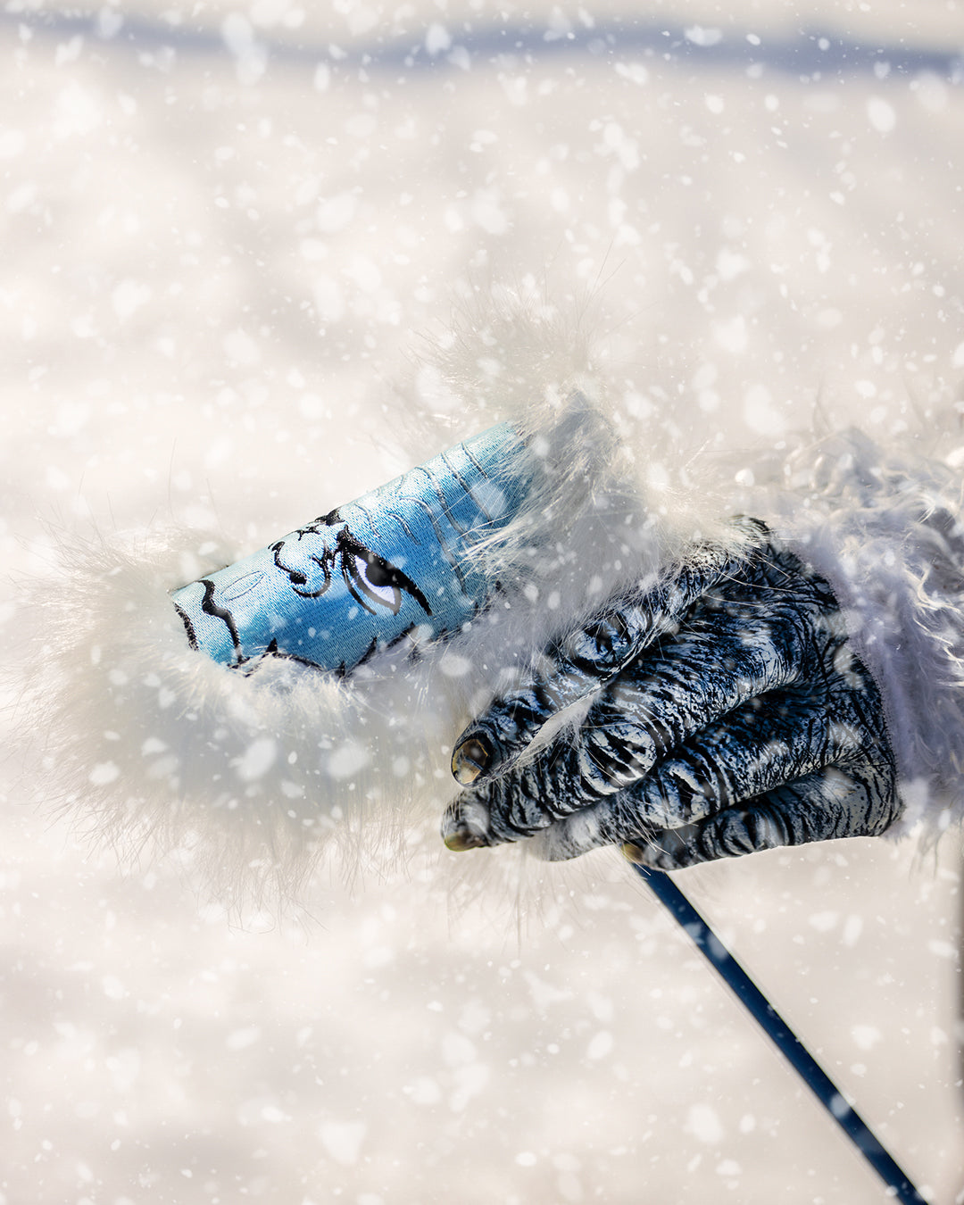 Yeti Blade Putter Cover featuring a detailed design and soft fur trim, perfect for adding style on the golf course.