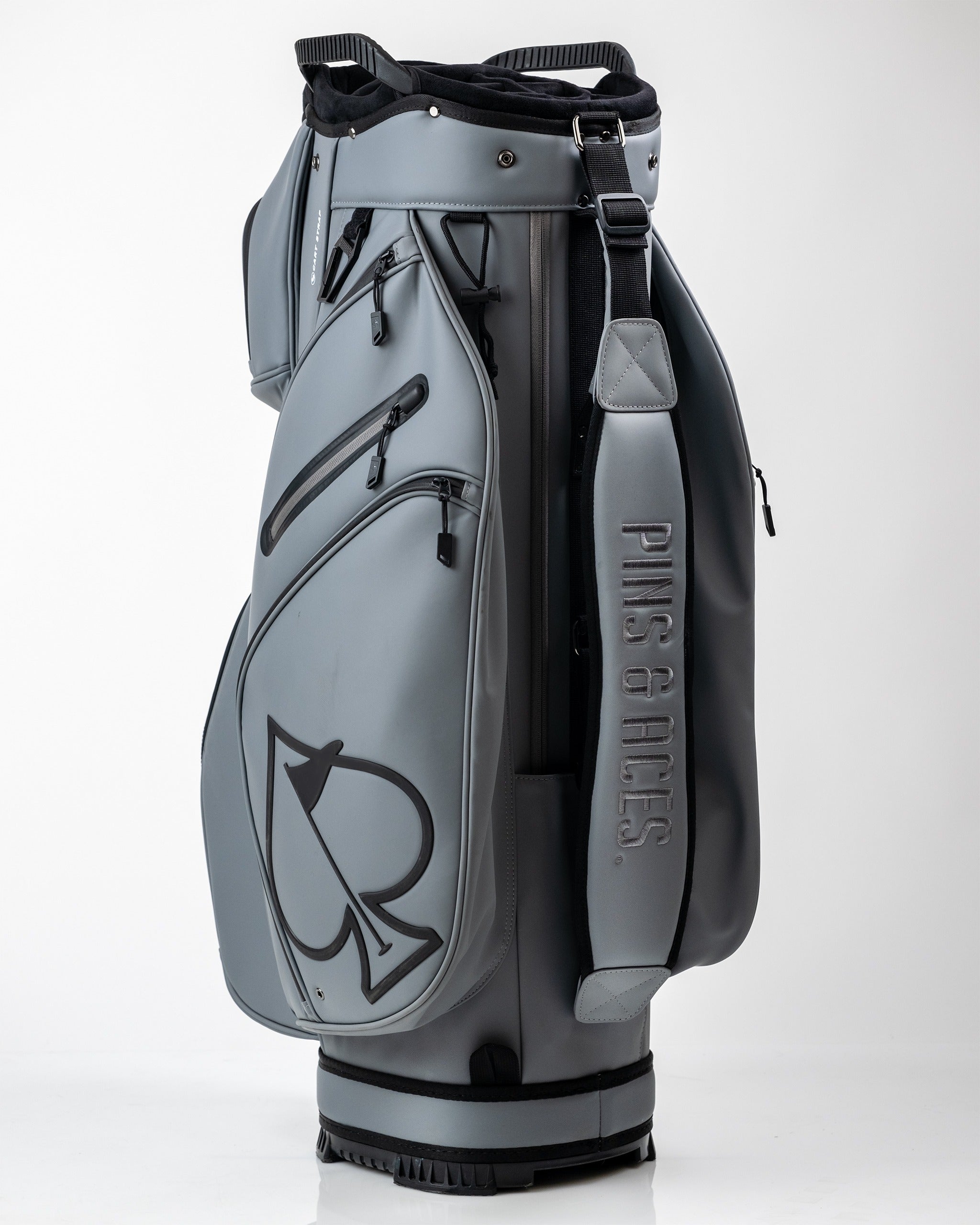 Player Preferred Cart Bag in Flat Ash features a sleek design with multiple pockets and a bold logo, perfect for stylish golfers.