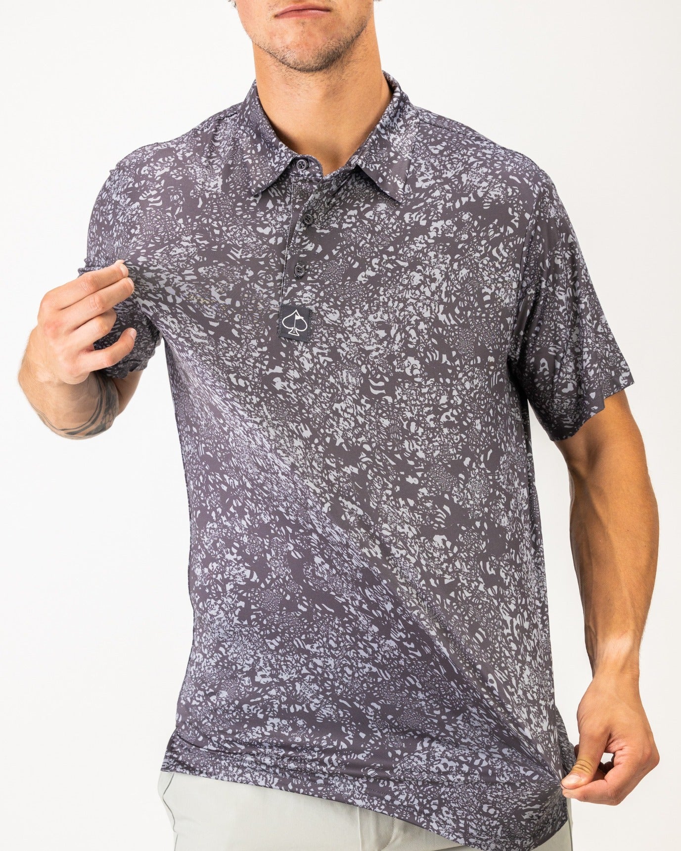 Men's golf shirt in volcanic ash pattern featuring a modern design and lightweight fabric for comfort on the course.