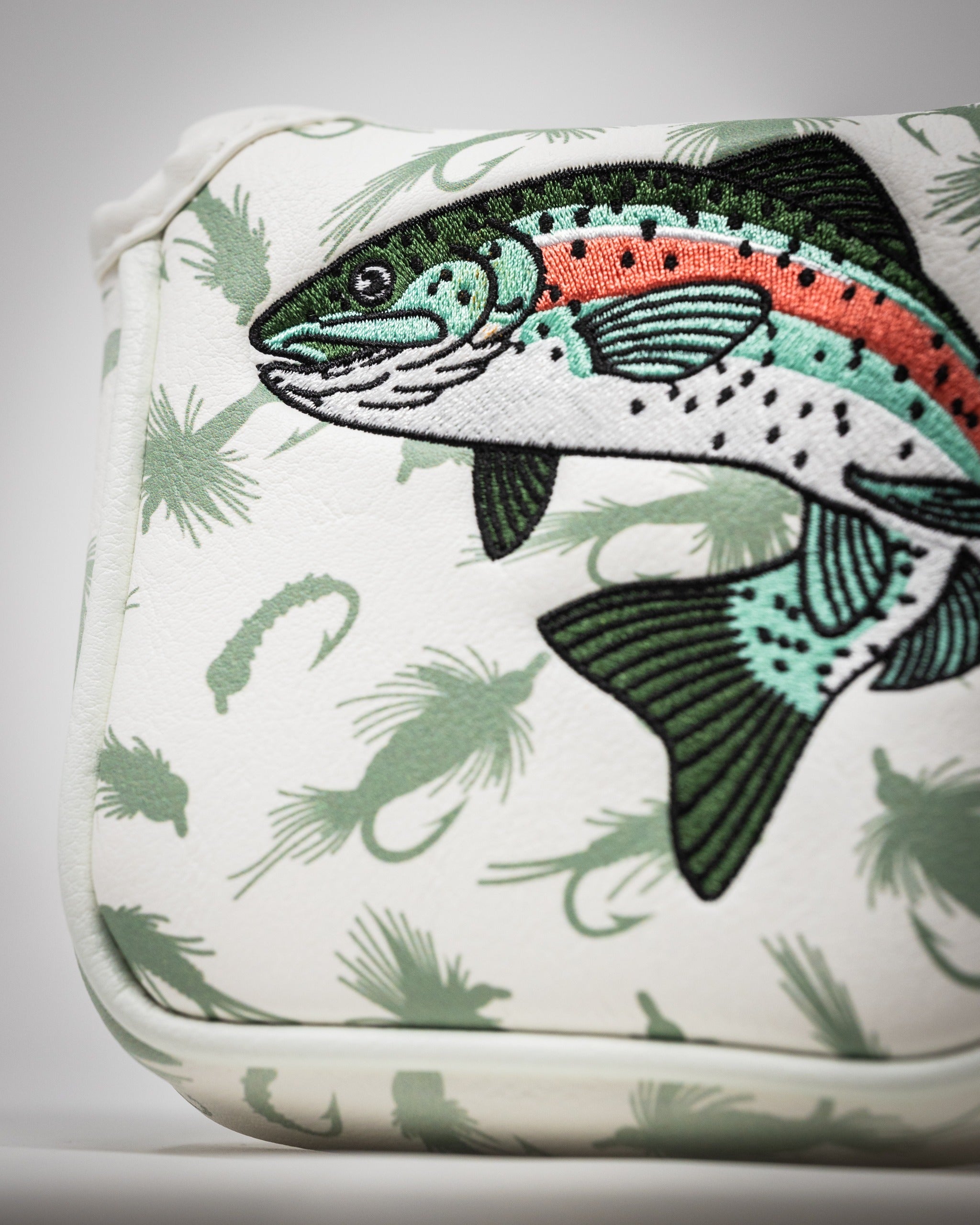 Trout mallet putter cover featuring a detailed fish design on a white background with green accents. Perfect for golfers.