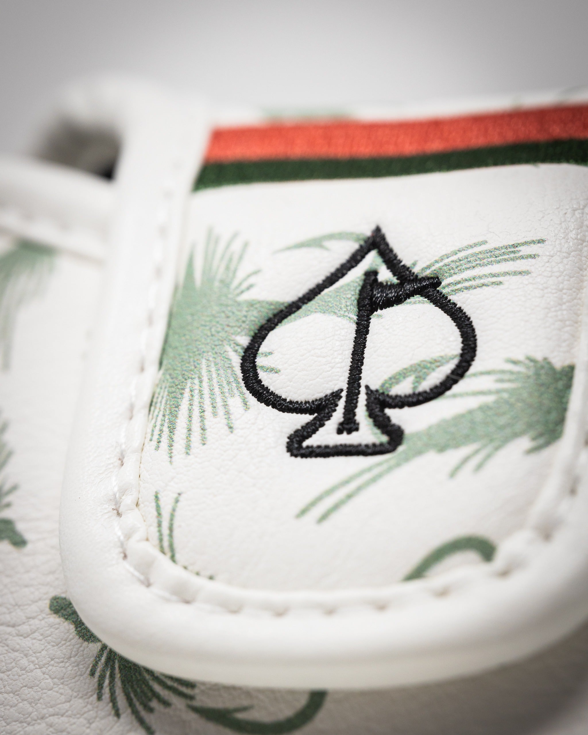 Trout mallet putter cover featuring a tropical design with palm leaves and a spade logo, ideal for stylish golfers.