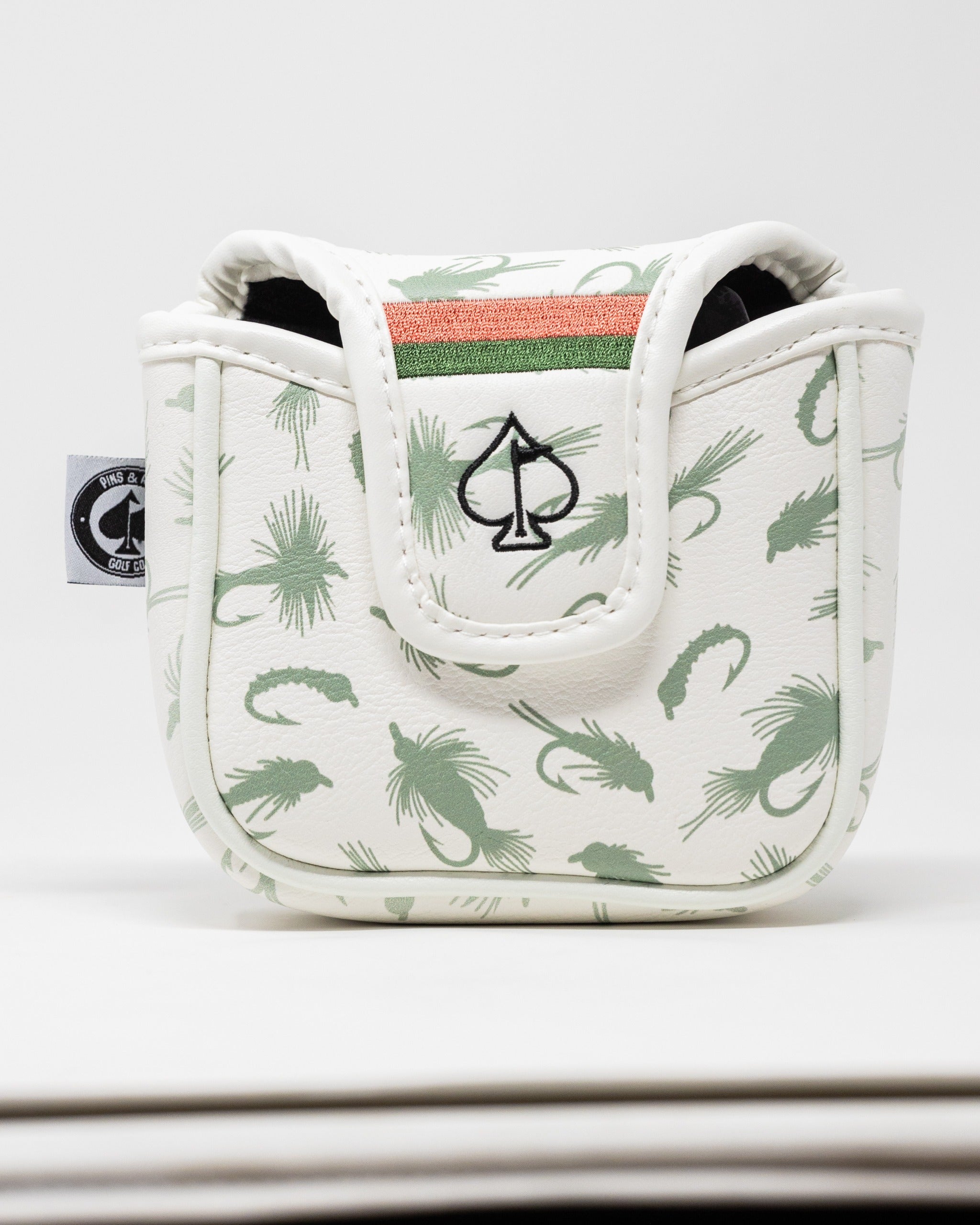 Trout mallet putter cover featuring a white design with green fish patterns and a striped accent, perfect for golfers.