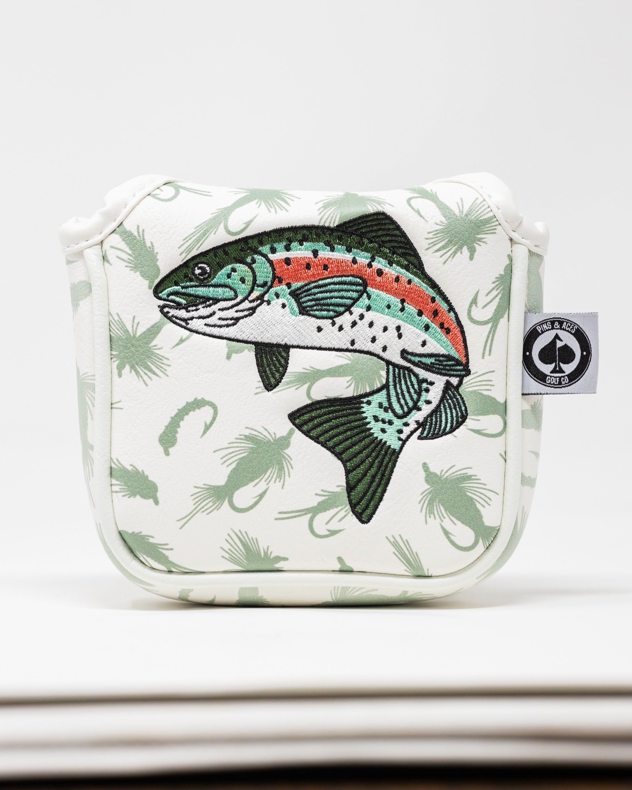 Trout mallet putter cover featuring a detailed fish design on a white background with green accents.