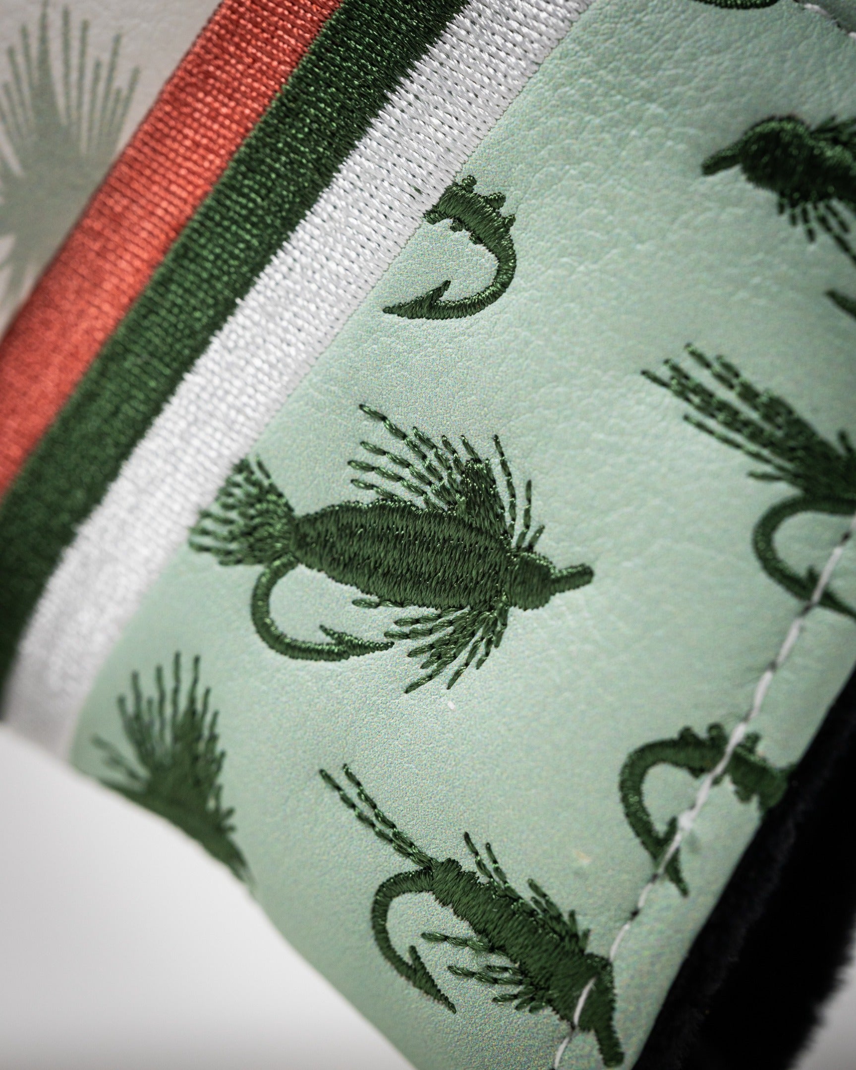 Trout mallet putter cover featuring a green fish pattern on a light background, perfect for unique golf style.