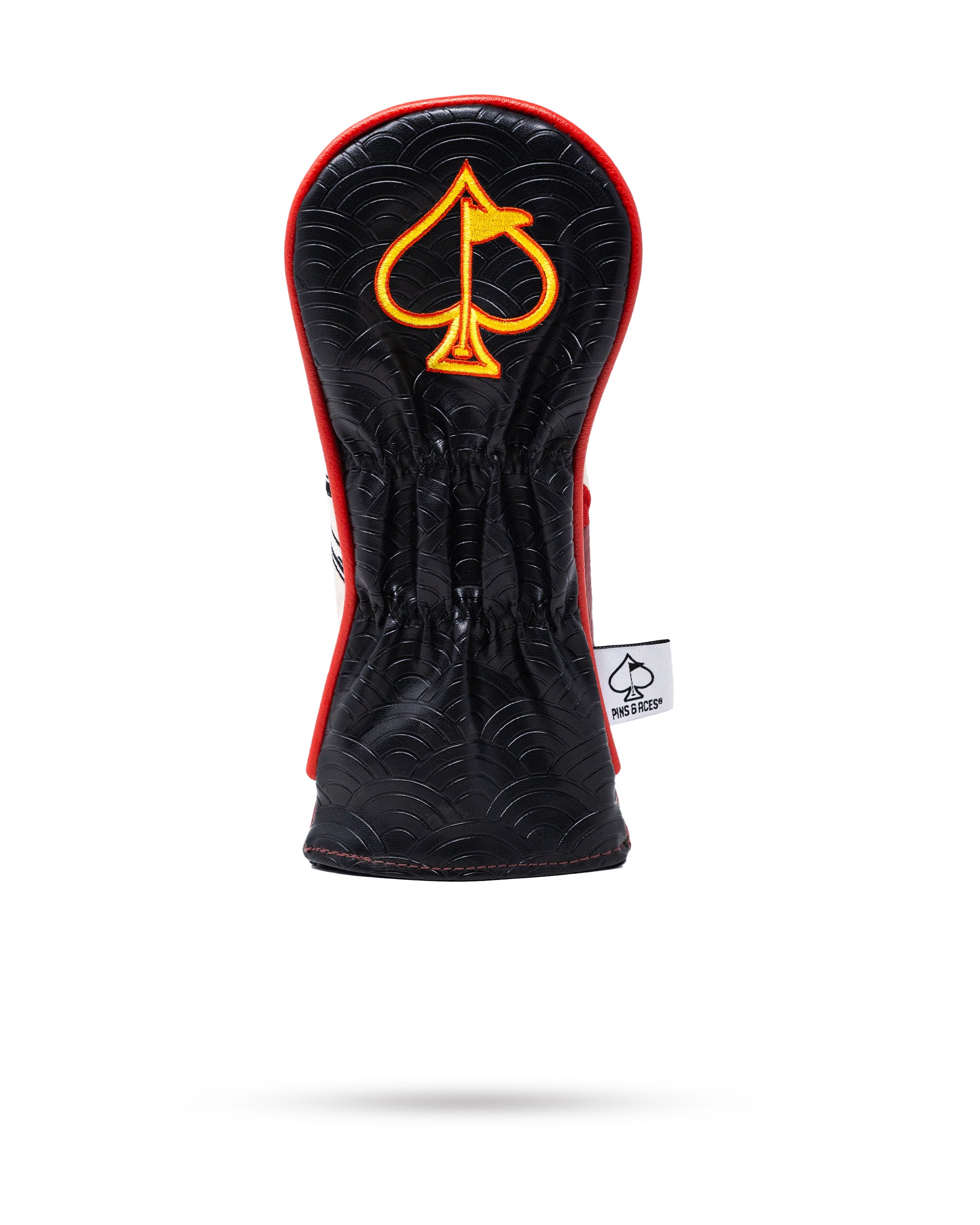 Bold black hybrid headcover featuring a striking red trim and an embroidered orange spade logo, designed for golfers.