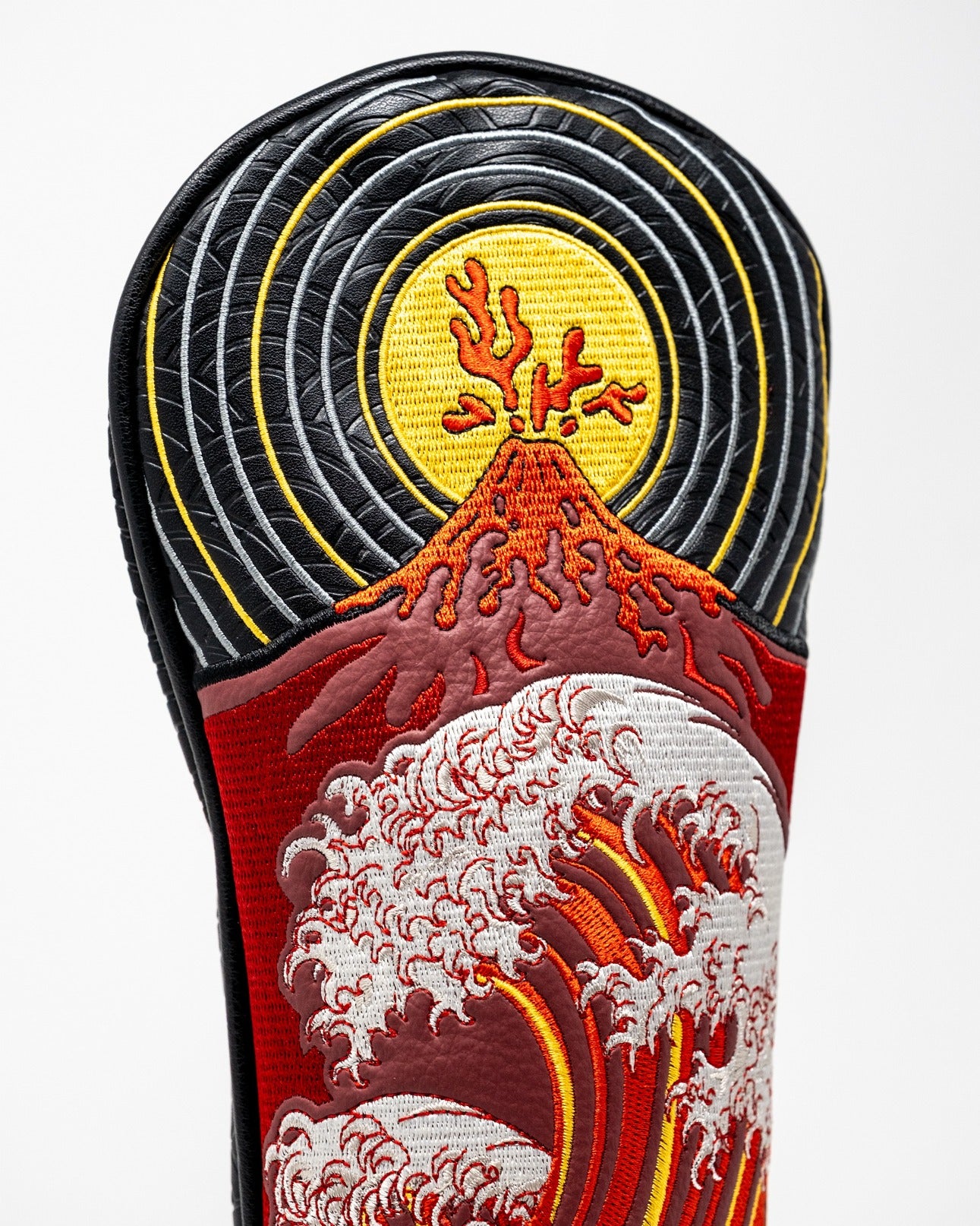 Bold fairway cover featuring vibrant embroidery of waves and a volcano, perfect for golfers seeking unique style on the course.