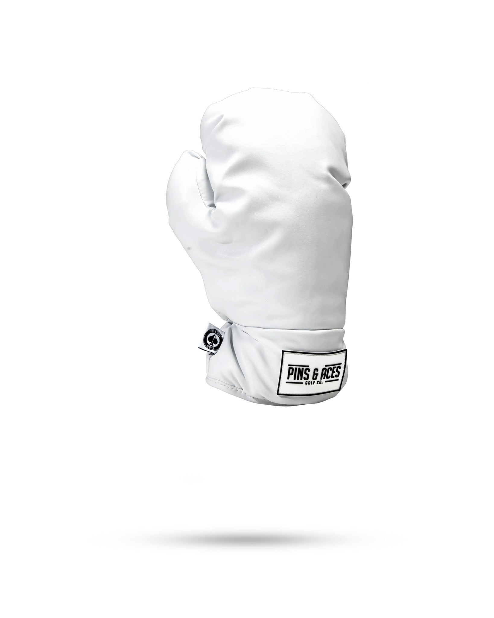 White boxing glove-shaped fairway cover designed for golfers, featuring the Pins and Aces logo for a unique style.