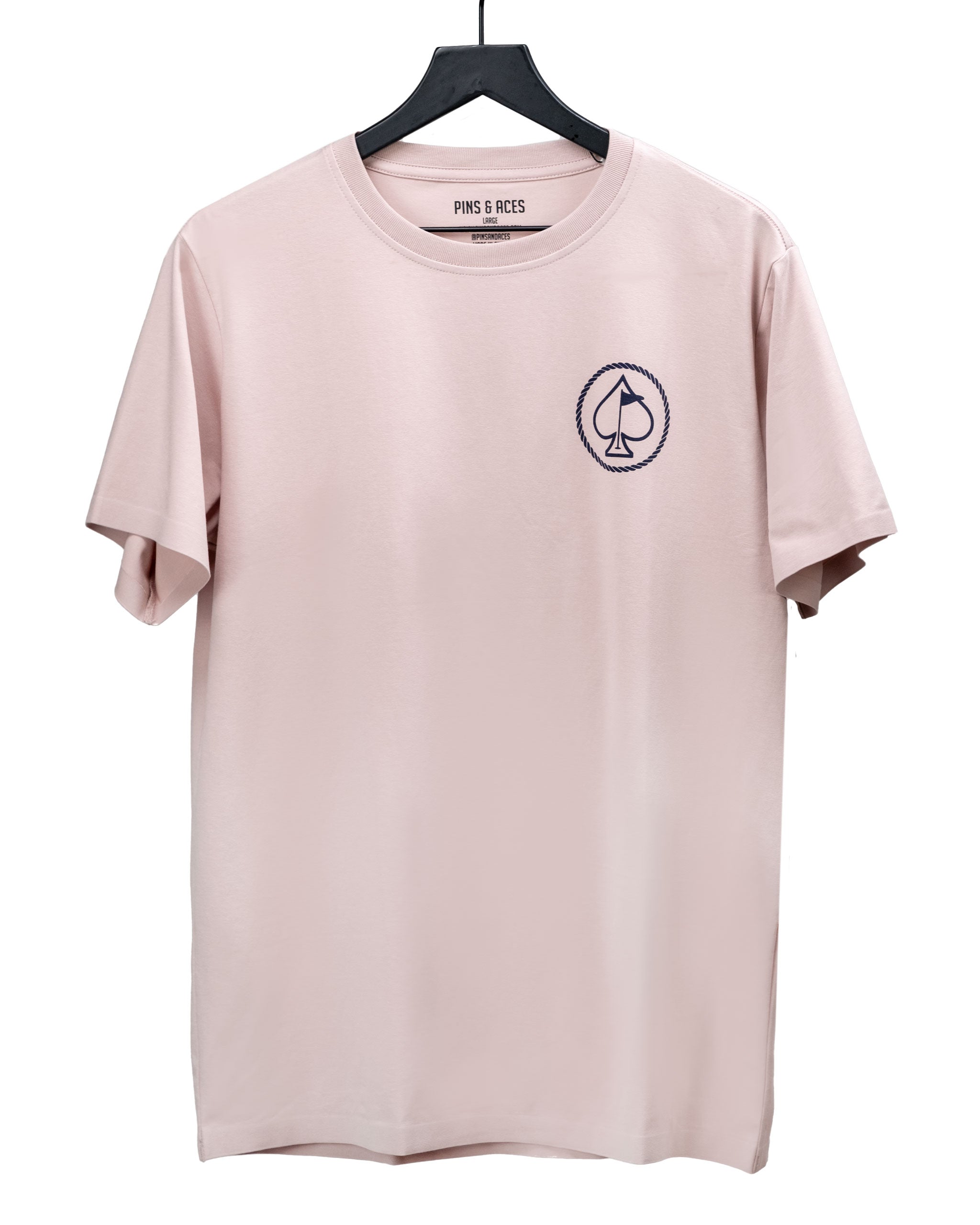 Light pink t-shirt featuring a small navy spade logo on the chest, perfect for stylish golf enthusiasts.