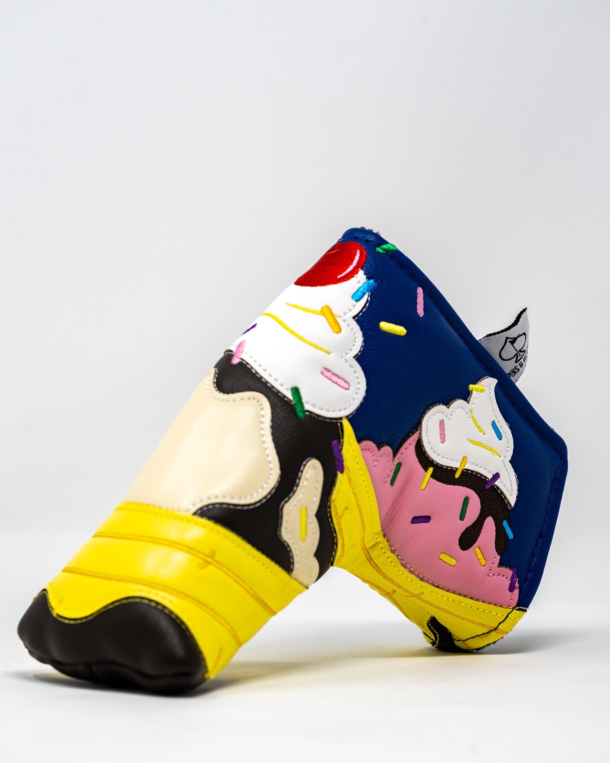 Colorful banana split-themed blade putter cover featuring ice cream and sprinkles design, perfect for stylish golfers.