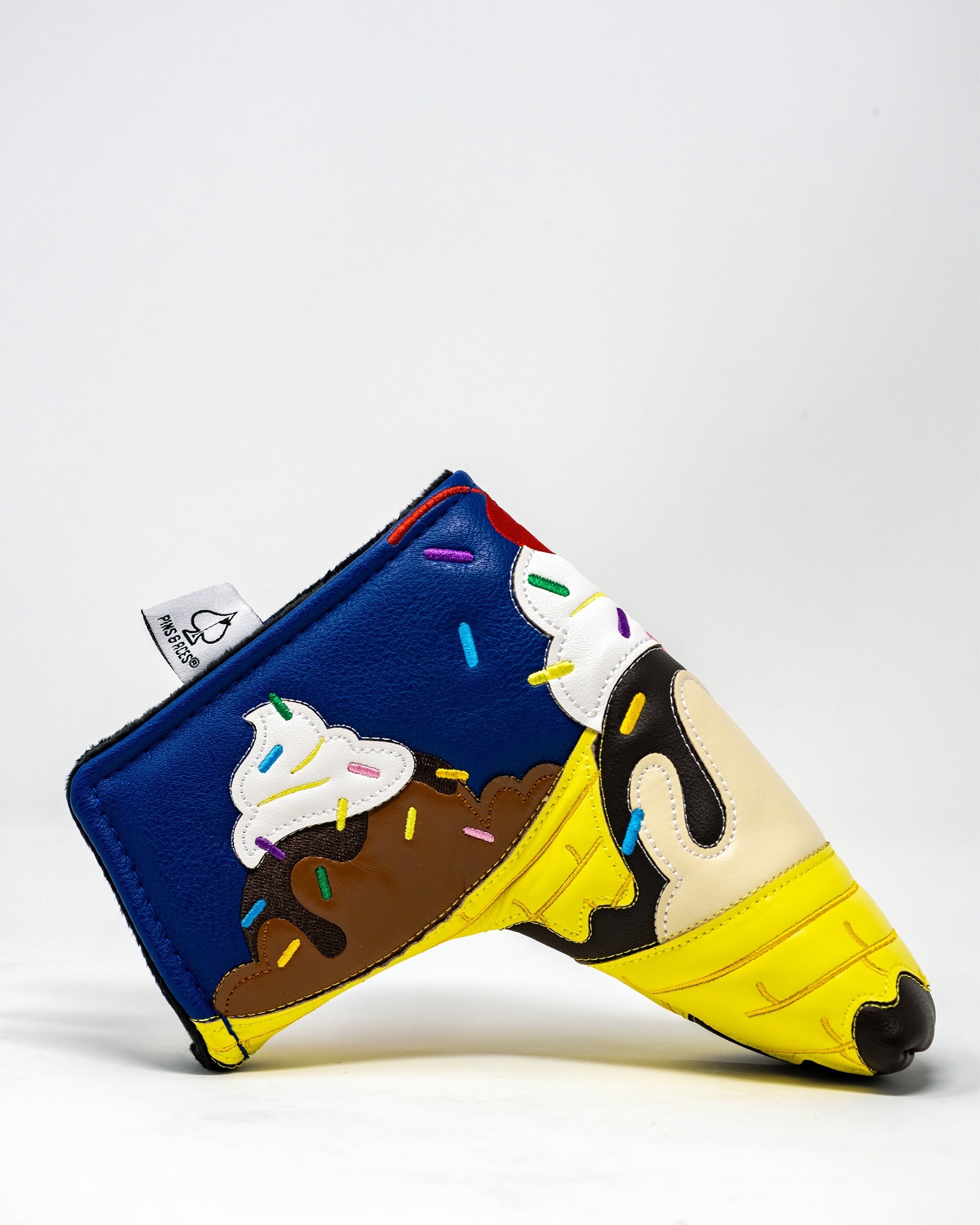 Colorful banana split-themed blade putter cover featuring ice cream, sprinkles, and a vibrant design for standout style.