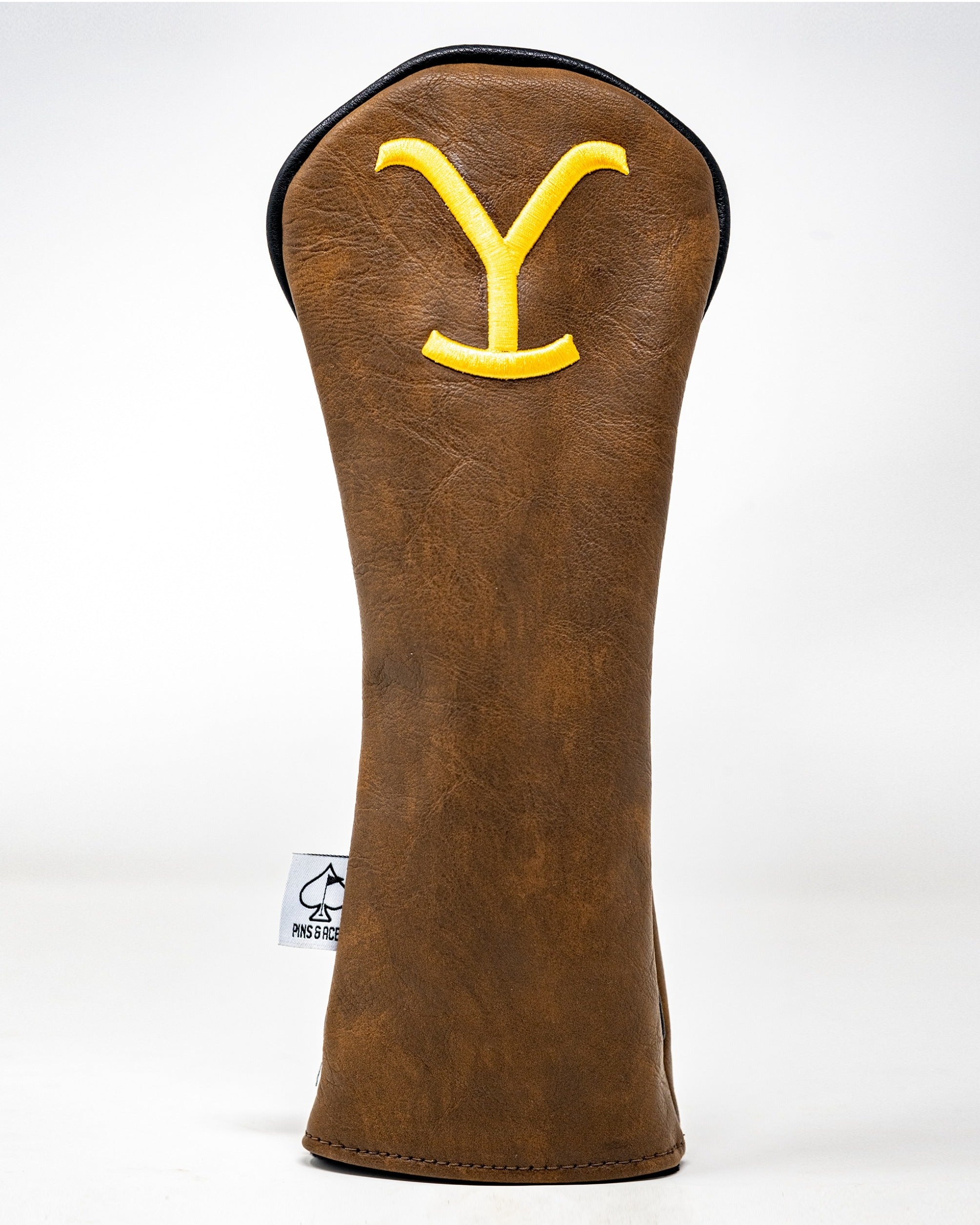 Brown leather golf fairway cover featuring a yellow "Y" logo, designed for stylish protection on the course.