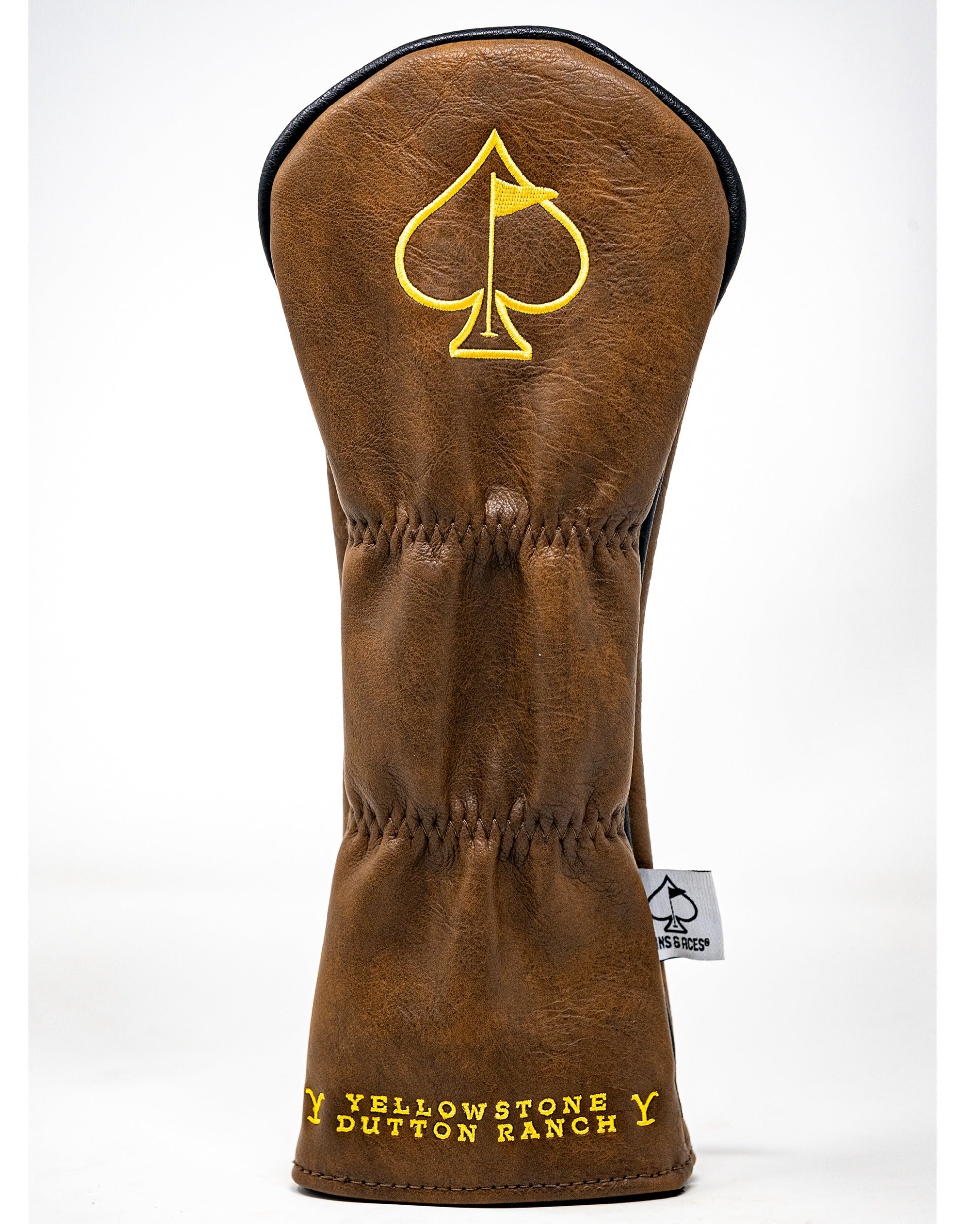 Brown leather golf fairway cover featuring a yellow spade logo and "Yellowstone Dutton Ranch" text. Ideal for stylish golfers.