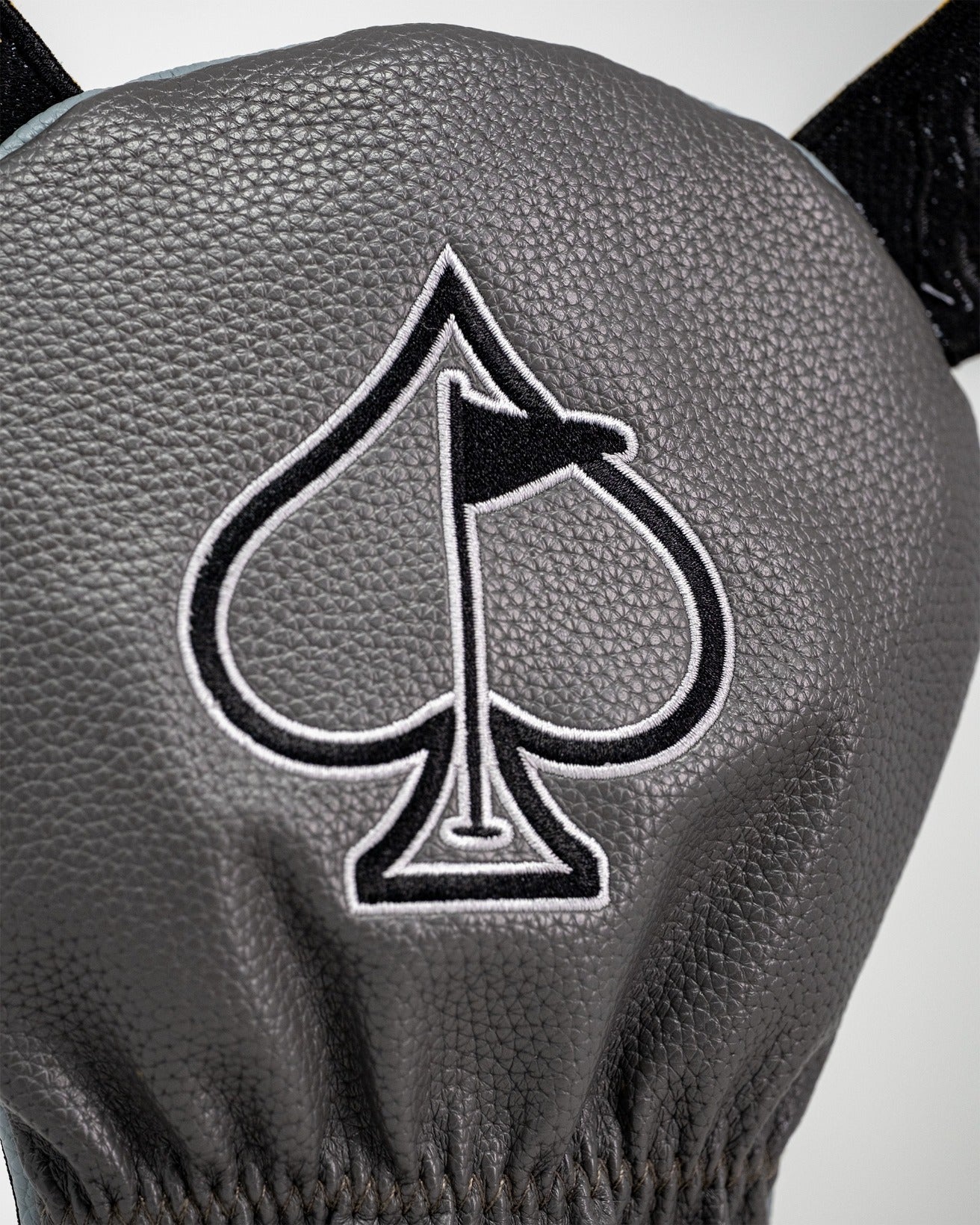 Stylish Rhino Driver Cover featuring a sleek gray design and a prominent black spade logo for golfers seeking unique accessories.