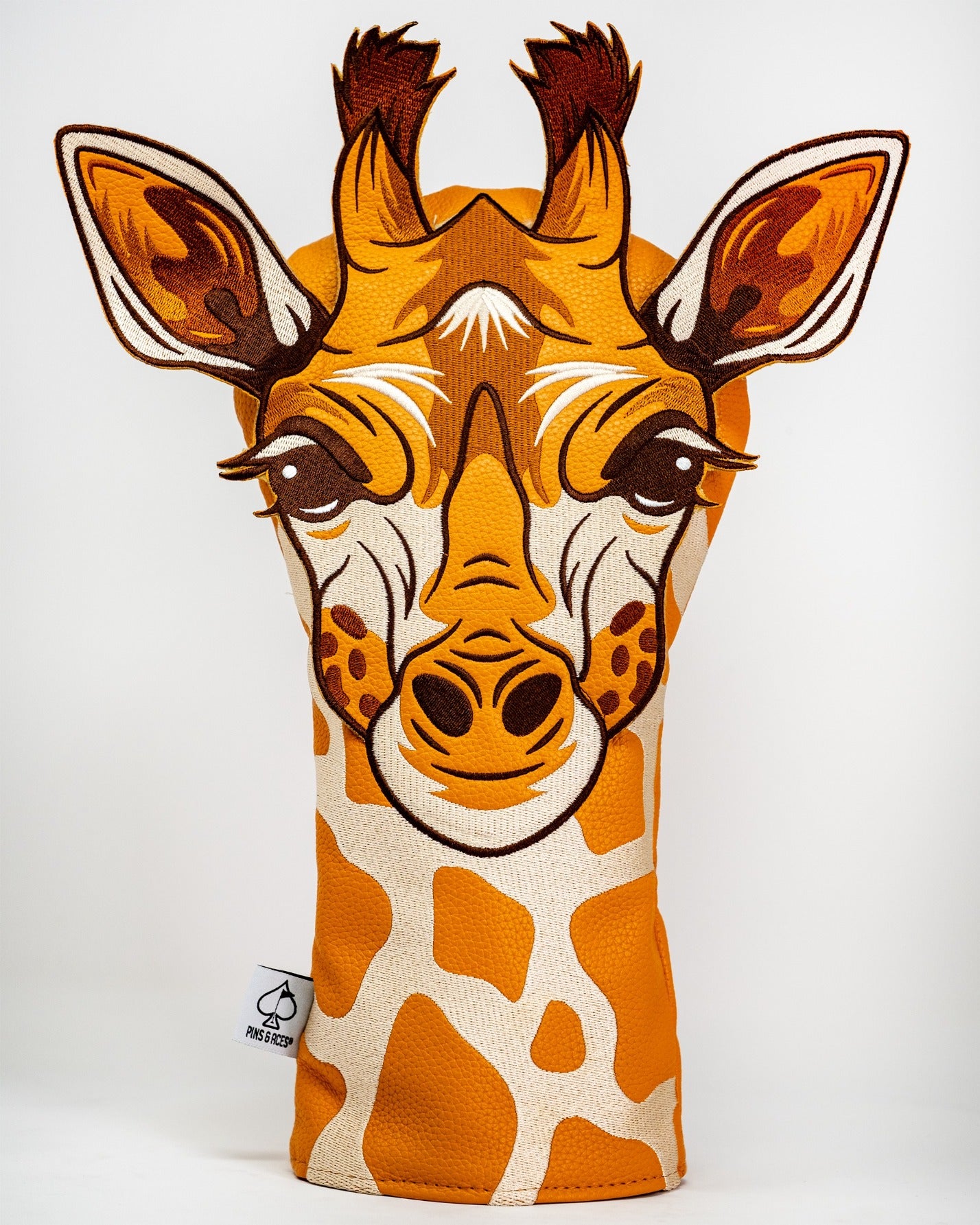 Giraffe driver cover featuring a detailed giraffe face design with vibrant colors, perfect for unique golf style.