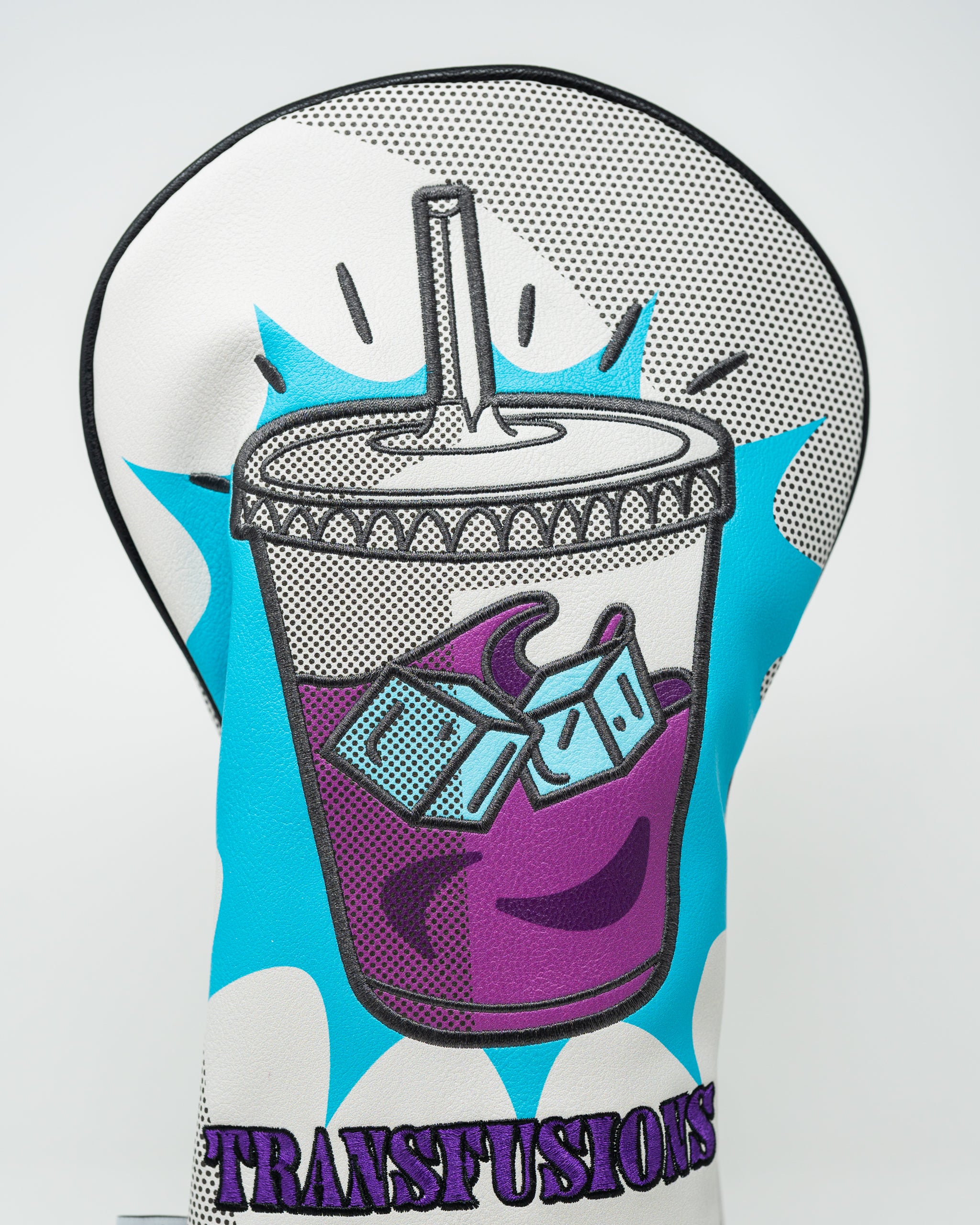 Bold golf driver cover featuring a colorful graphic of a drink cup with ice, labeled "TRANSFUSIONS" for a standout look.