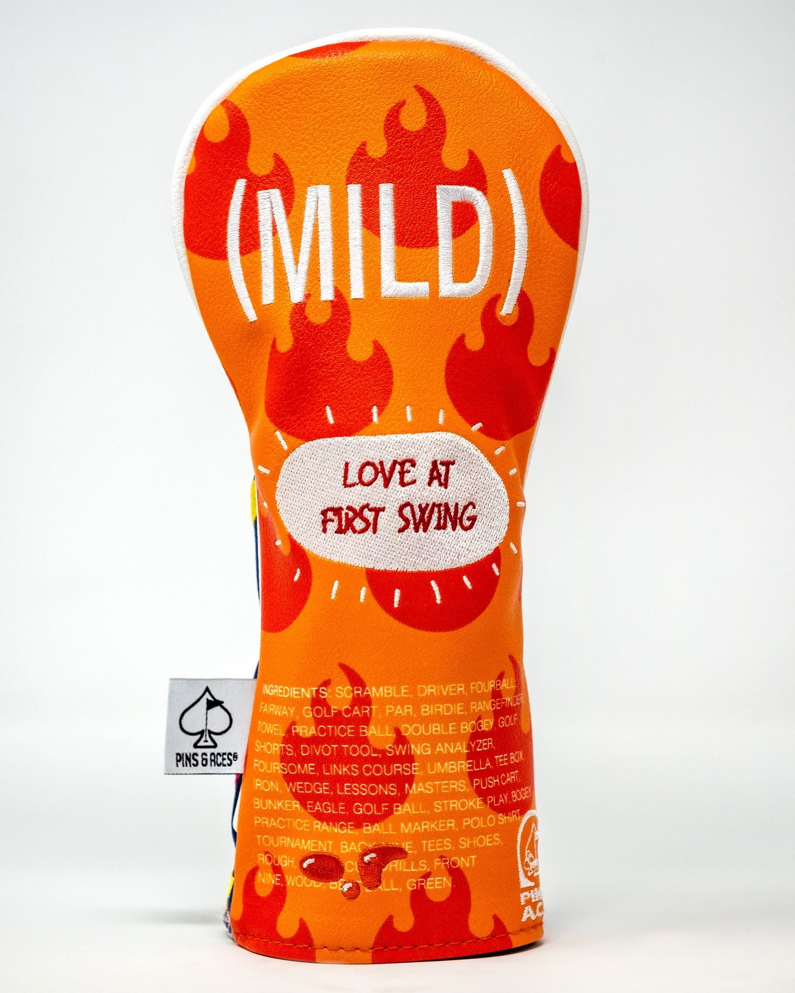 Bold golf headcover featuring a vibrant orange design with flames and the text "MILD" and "LOVE AT FIRST SWING.