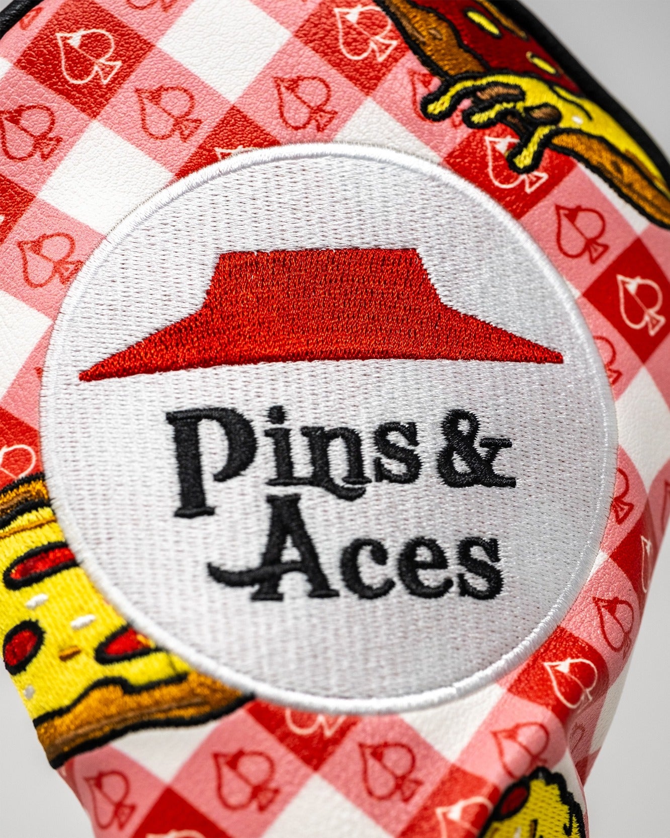 Bold fairway cover featuring a playful pizza design and the Pins & Aces logo, perfect for stylish golfers.