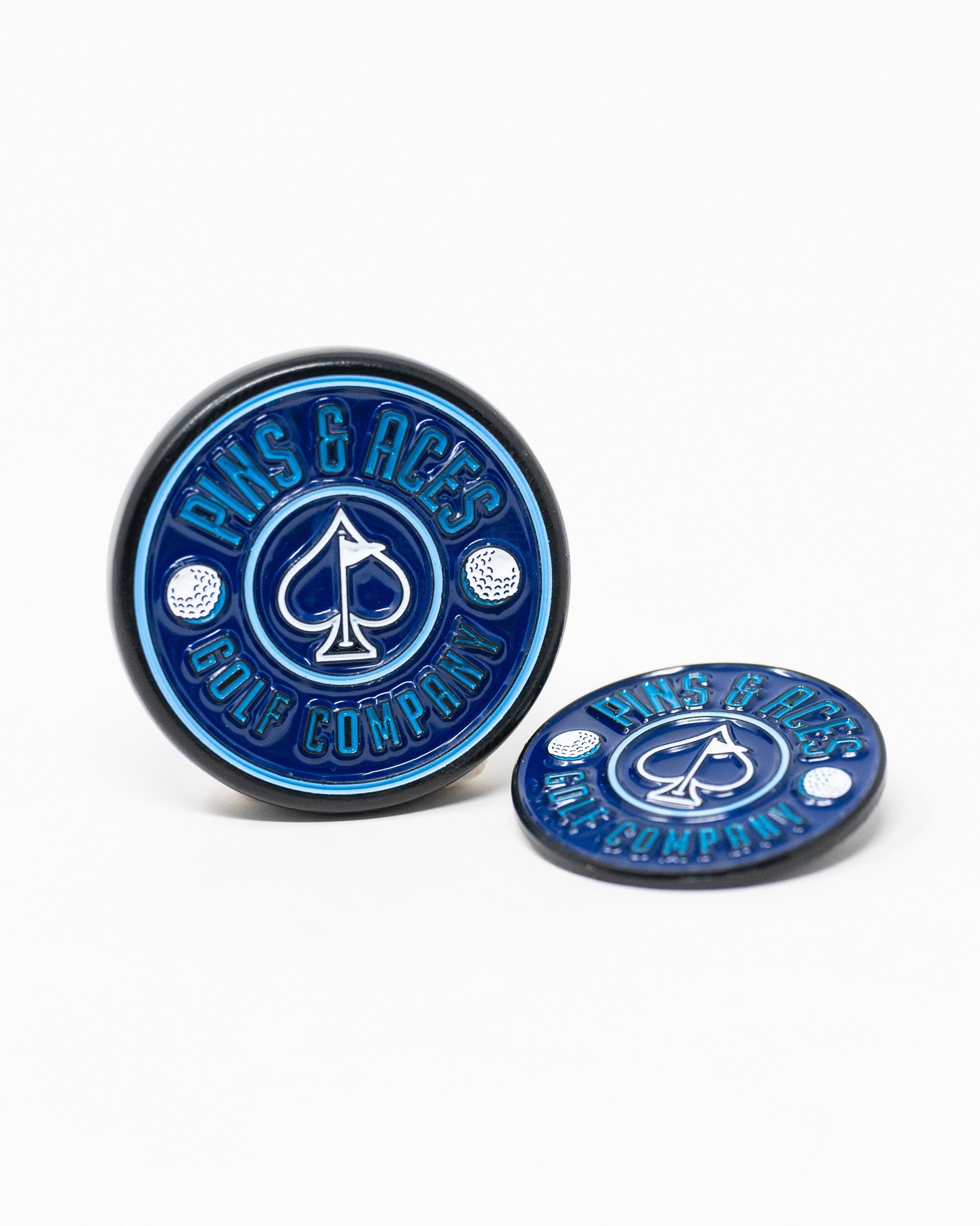 Navy pop-out medallion ball marker featuring a spade logo and golf elements, perfect for stylish golfers.