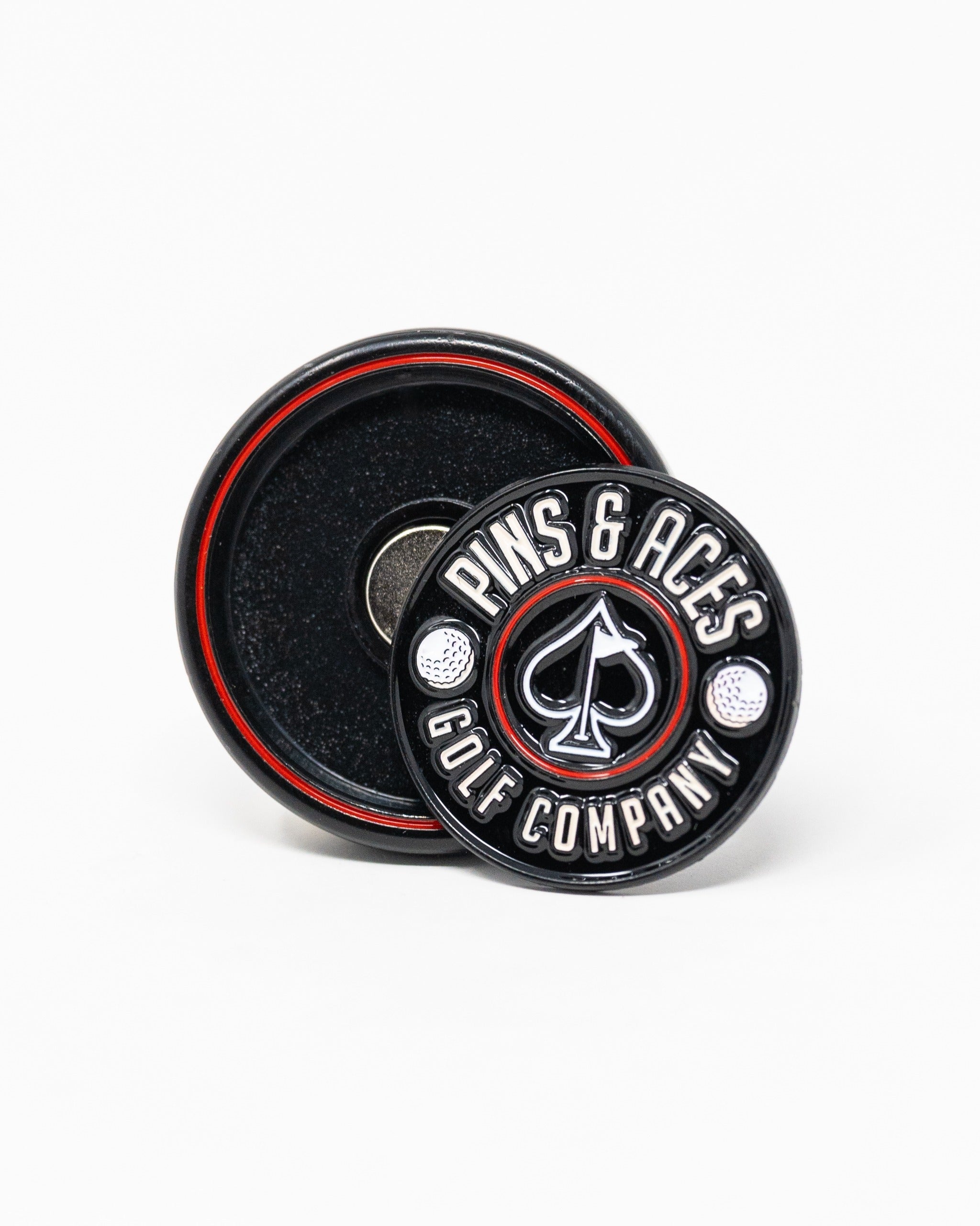 Black Pop Out Medallion Ball Marker featuring a bold design with the Pins and Aces logo, ideal for stylish golfers.