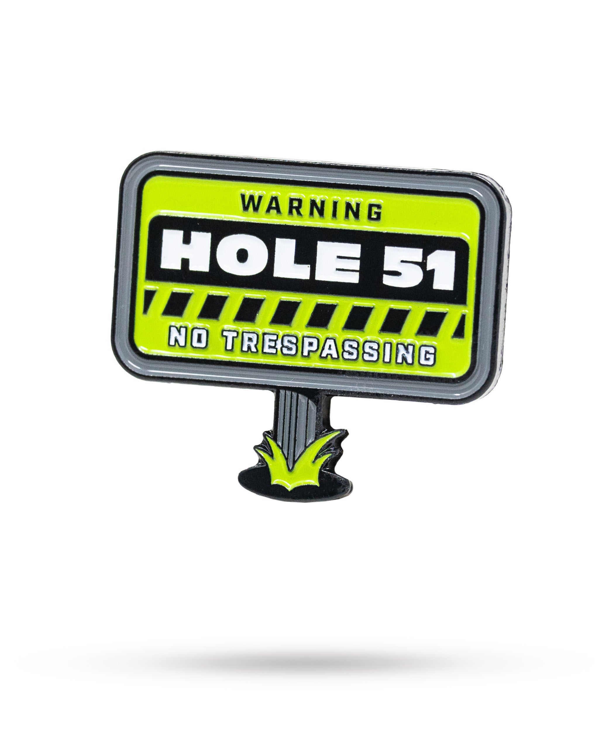 Bold HEYDUDE Hole 51 ball marker featuring a vibrant warning sign design with "Hole 51" and "No Trespassing" text.