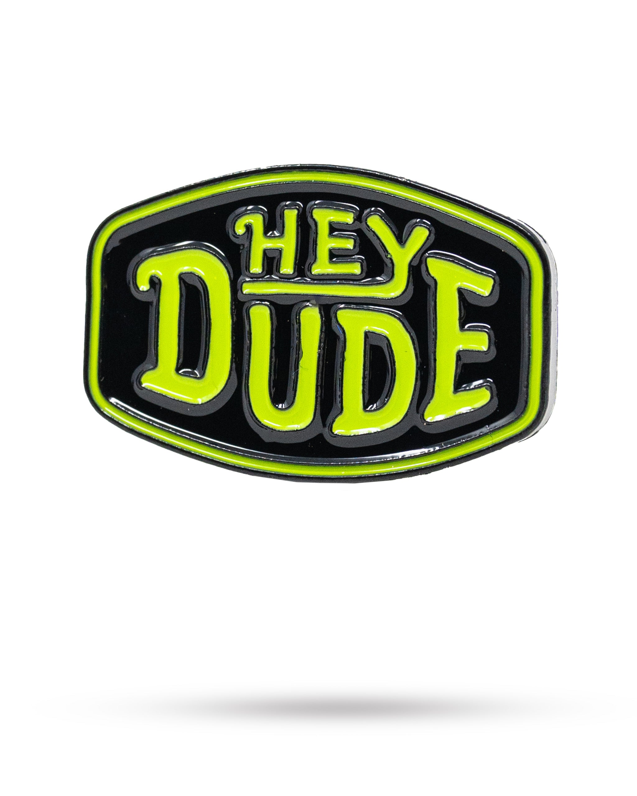 Bold HEYDUDE logo ball marker featuring a vibrant green and black design, perfect for golfers looking to stand out.